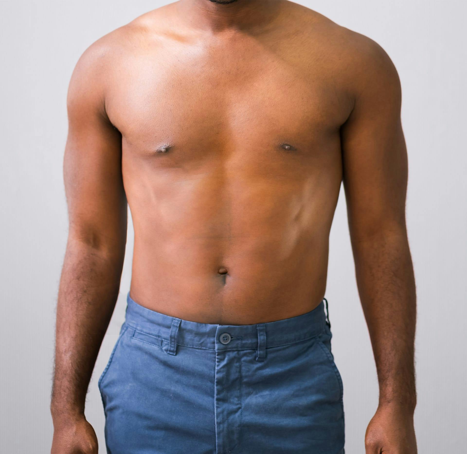 man's body with blue jeans