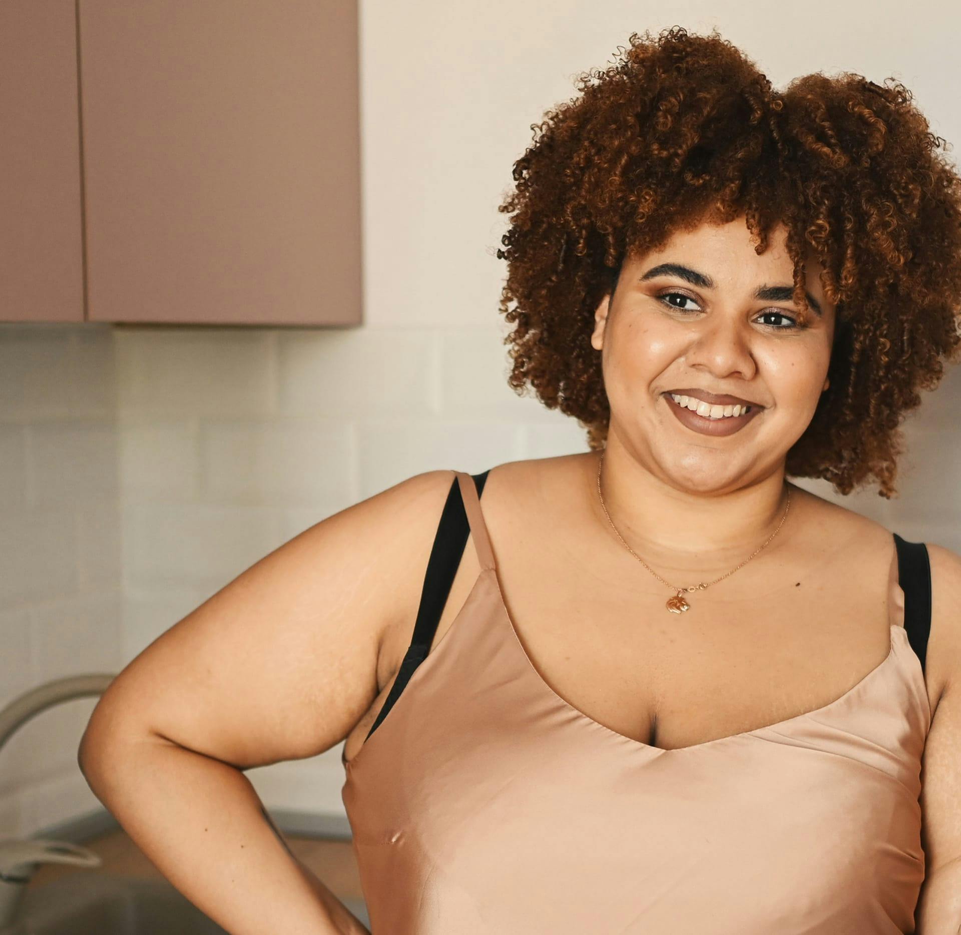 woman with afro smiling