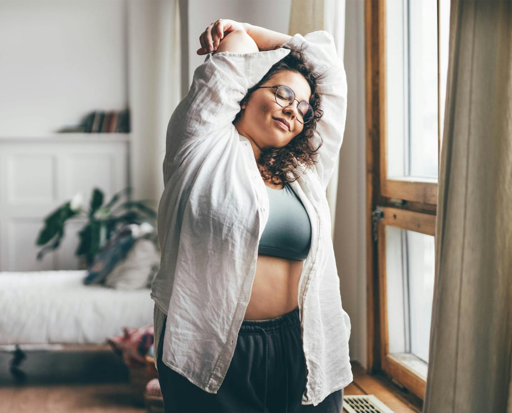 woman stretching arm over her head