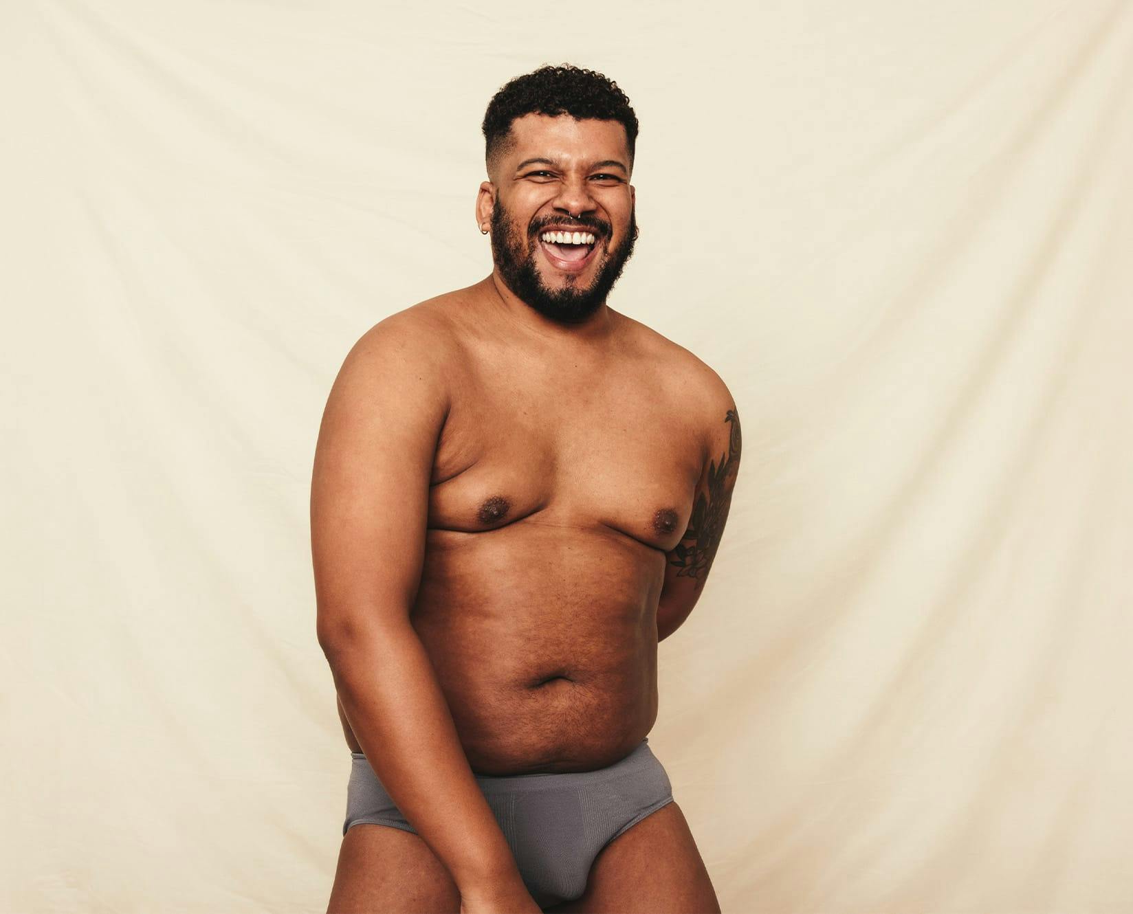 man in underwear smiling