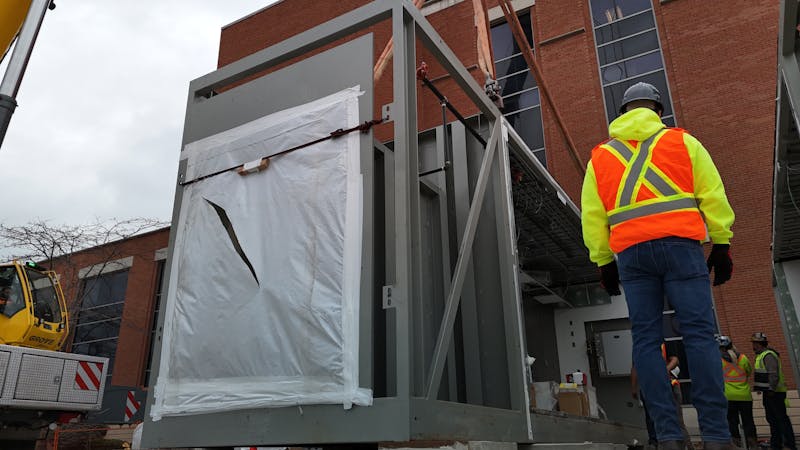 men assembling a modular building