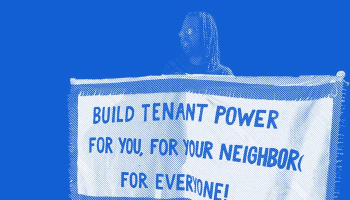 Man holding bannr sayinb build tenant power