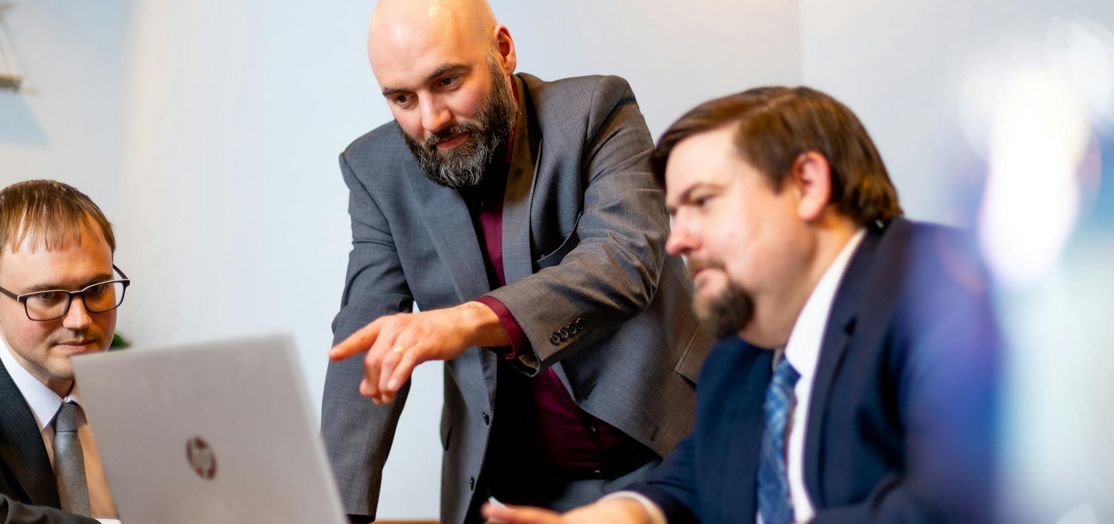 Robert J. Hanauer & Christopher A. Nelson Viewing a Laptop - Parentage And Paternity Banner