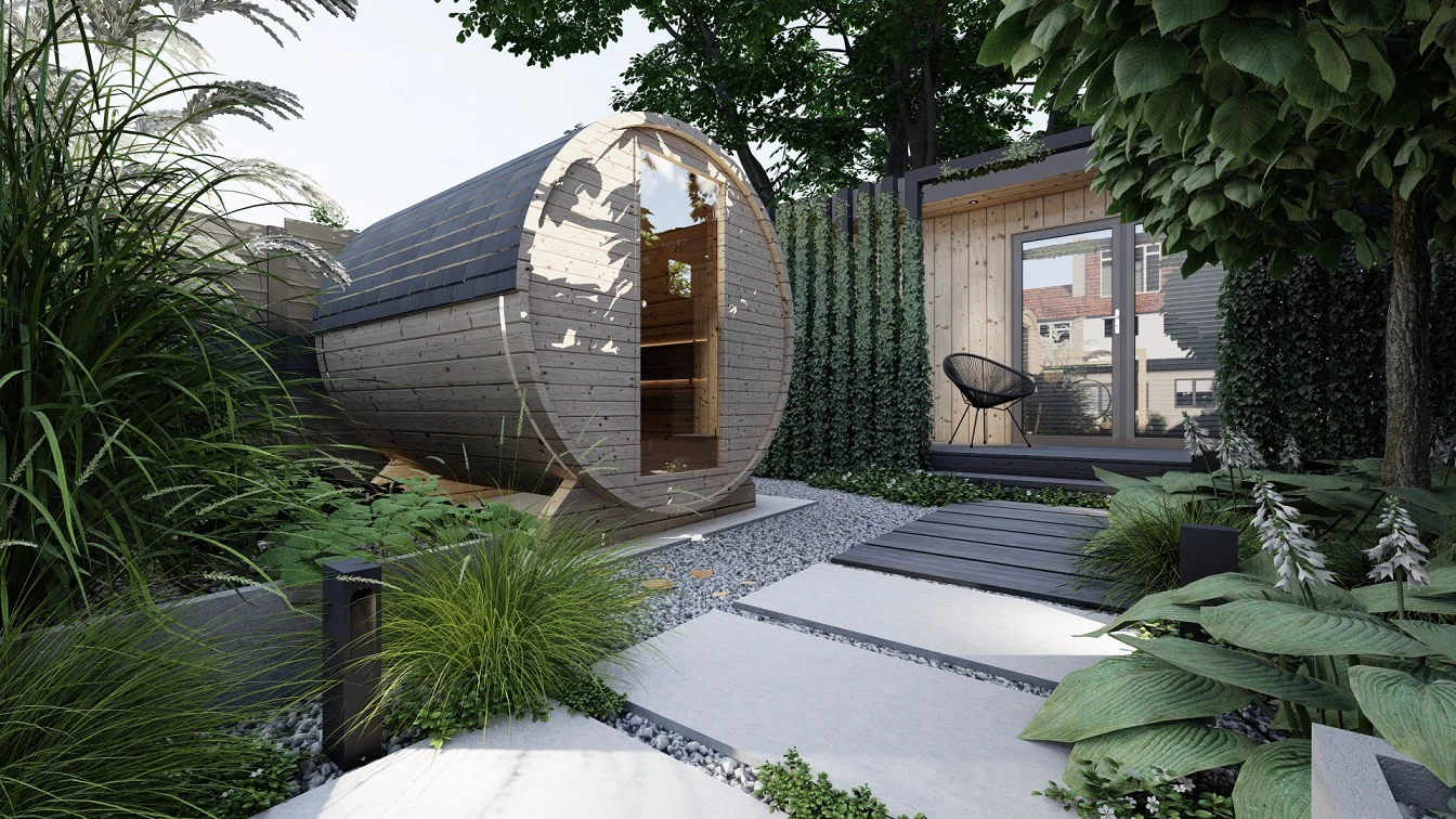 Sauna ogrodowa w kształcie beczki w otoczeniu roślin ozdobnych z liści.