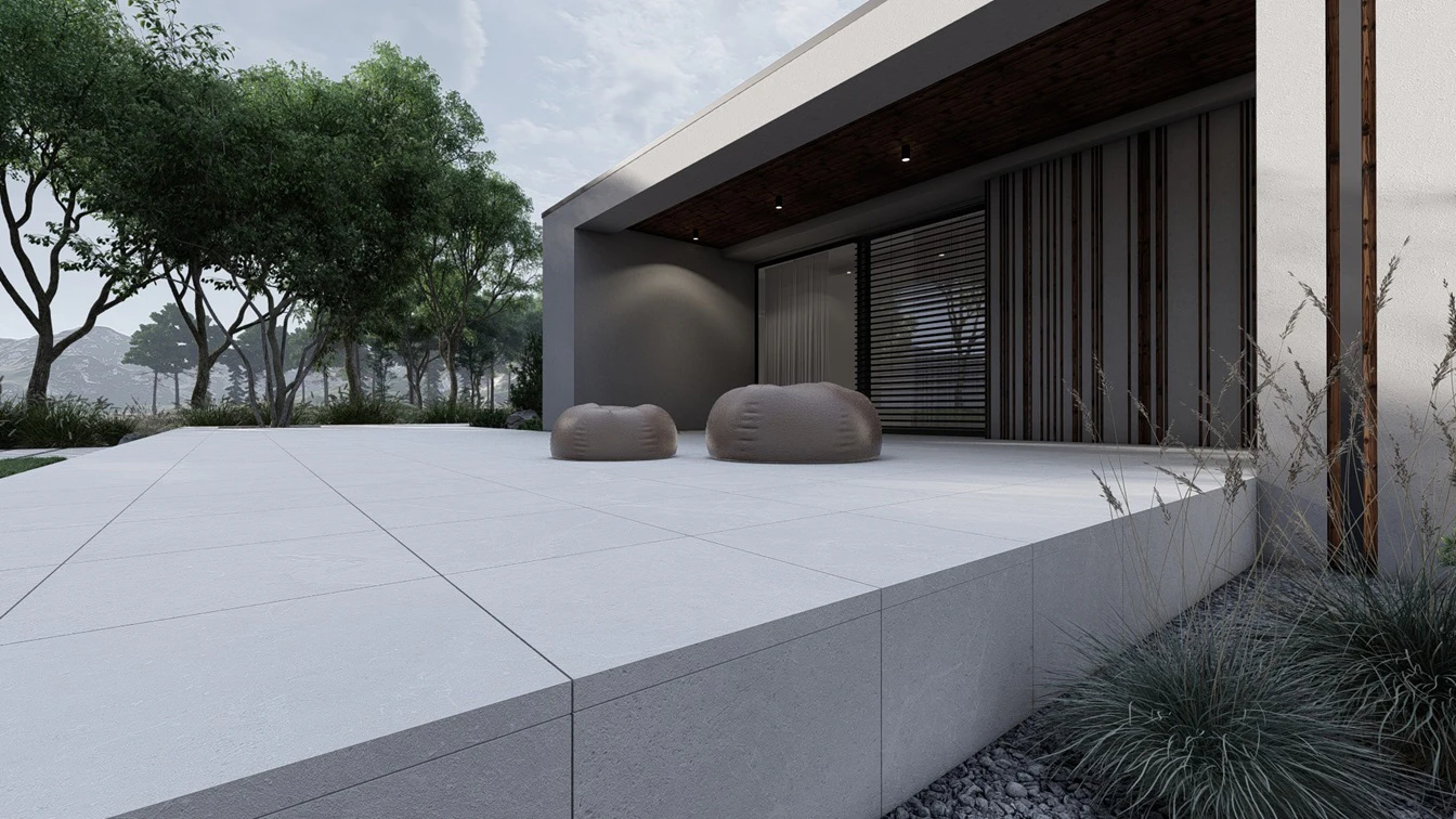 Taras przy budynku w otoczeniu gór.