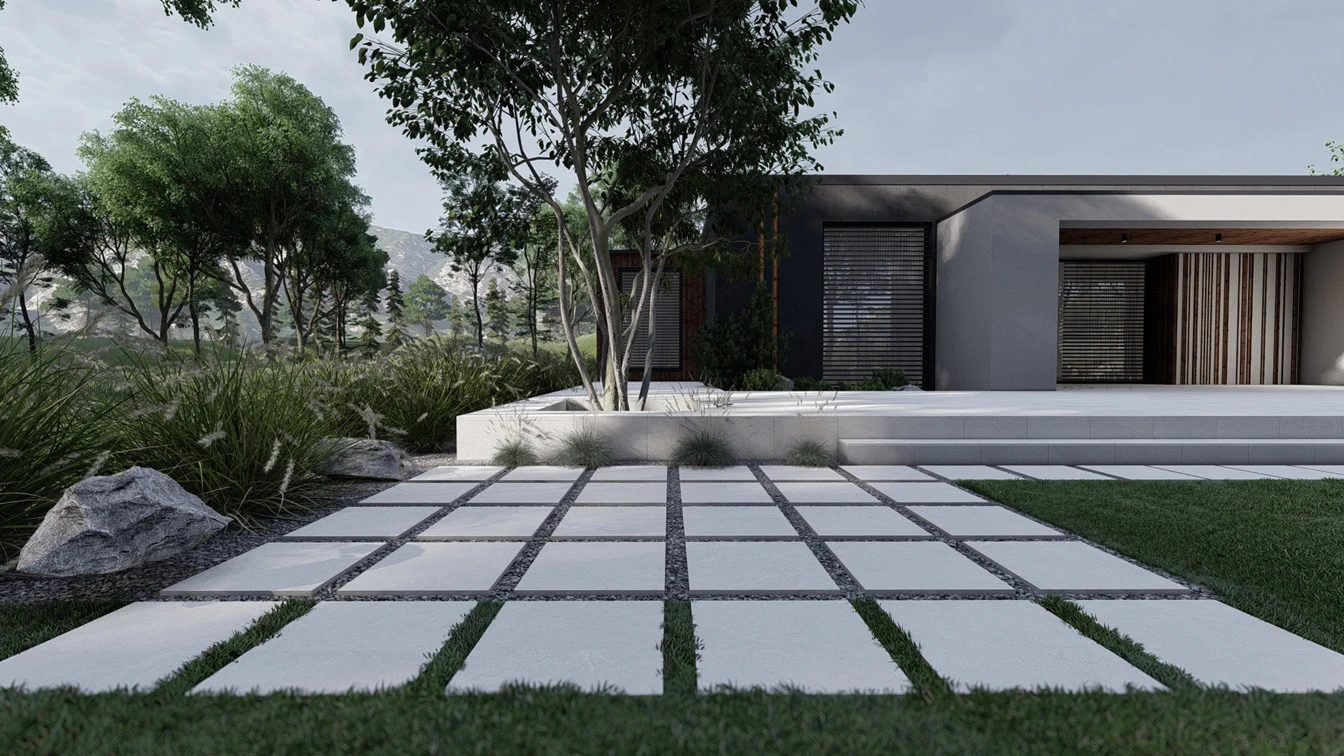 Płyty tarasowe w grysie i trawie.