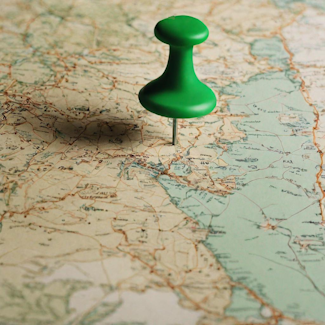 Prompt: A green pushpin in an old-fashioned map