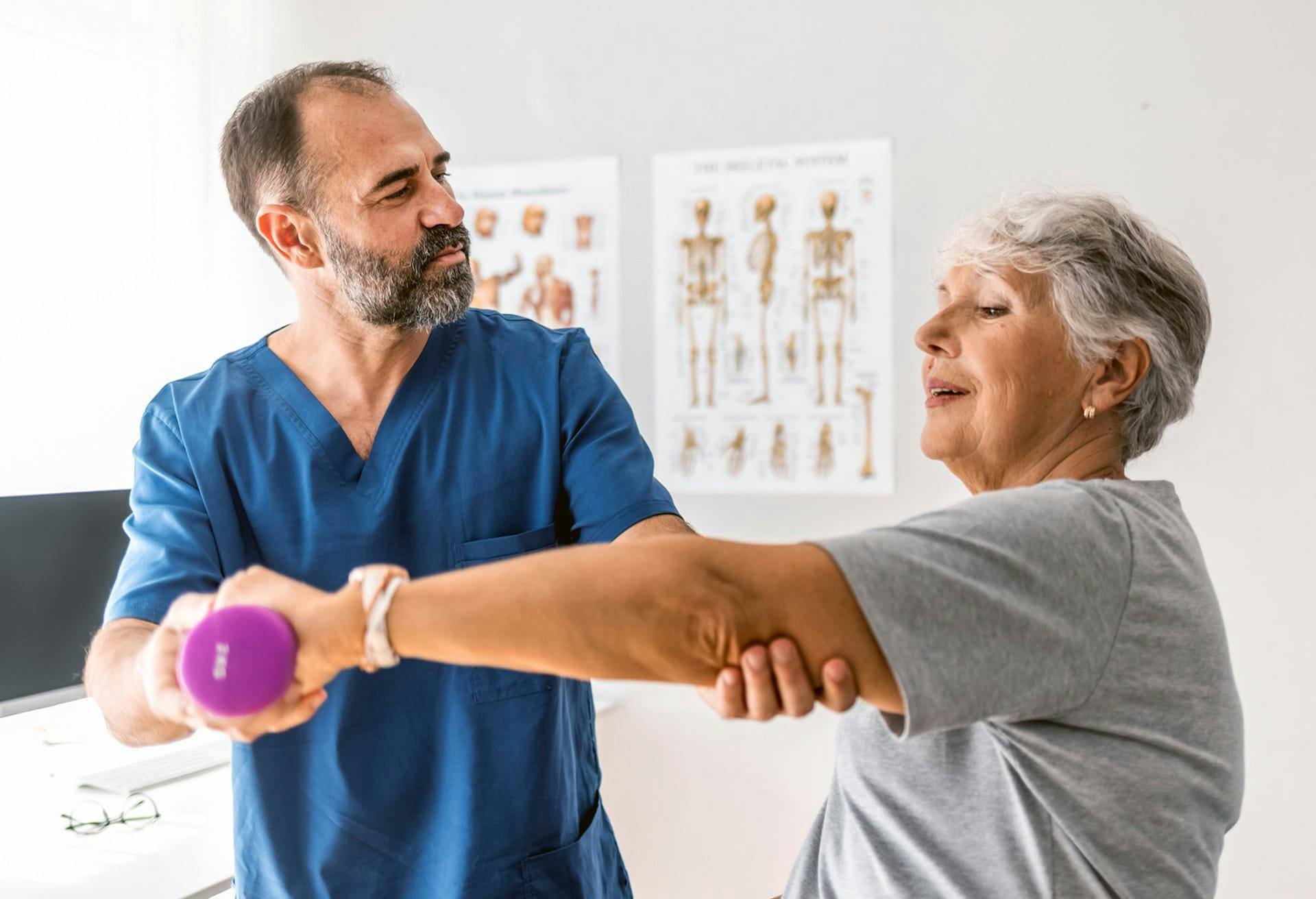 Man examining lady's arm