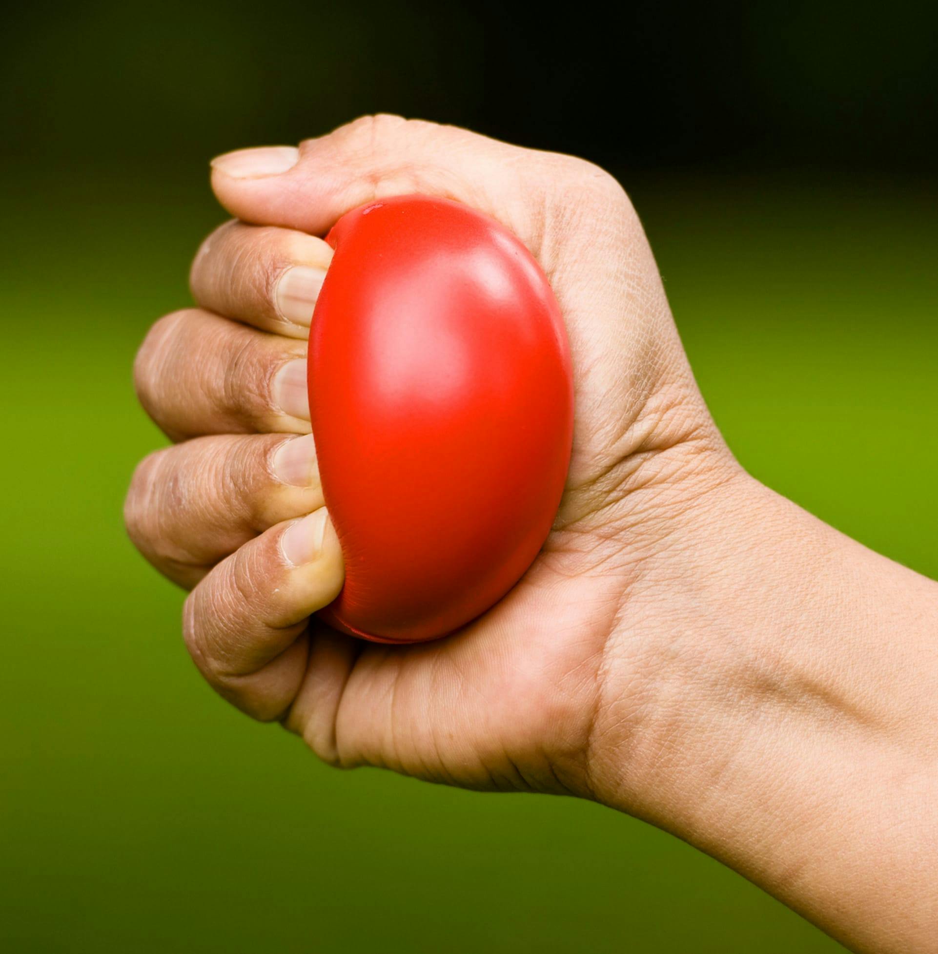 Person squeezing ball