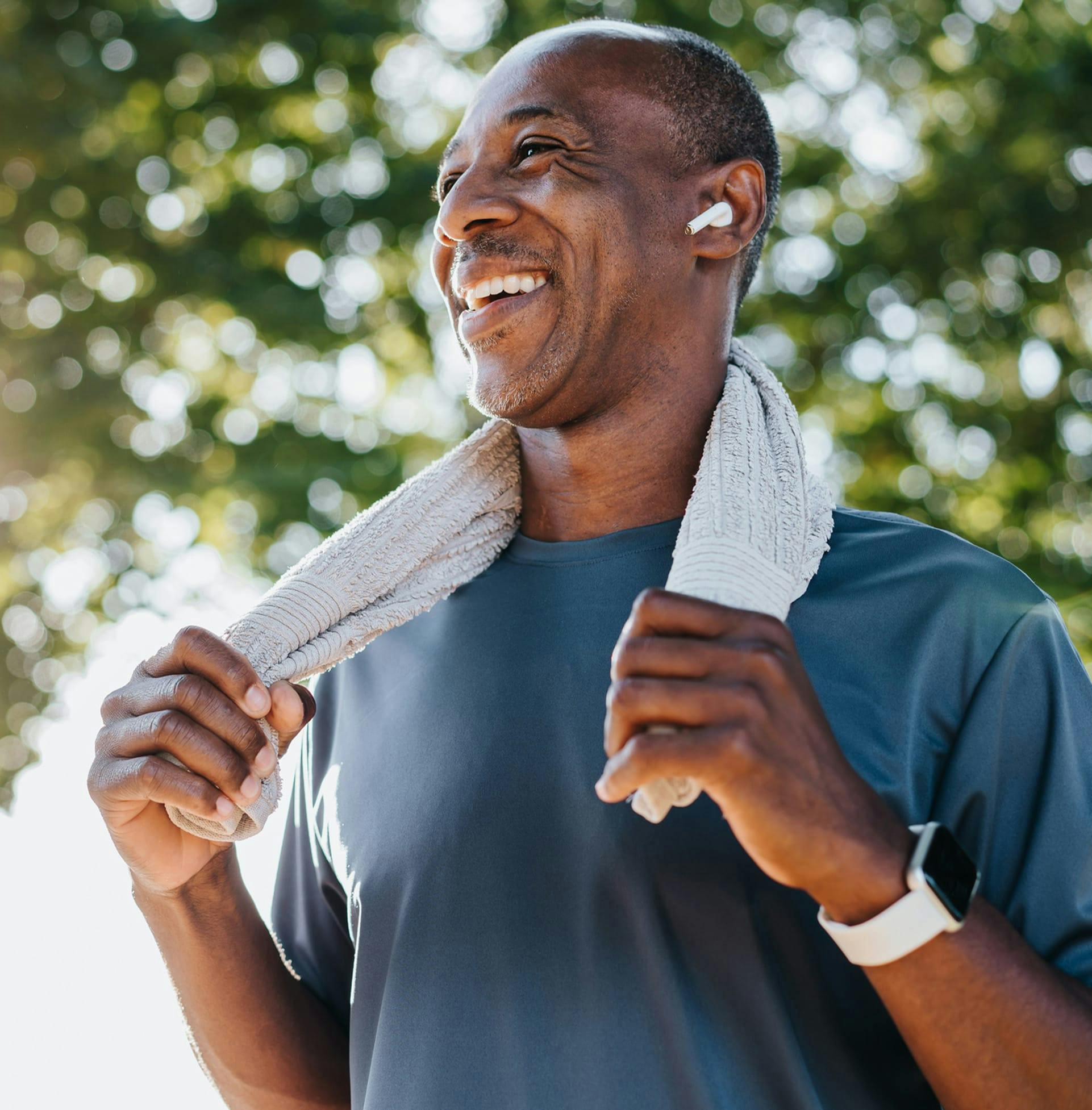 Man Smiling with towel around neck