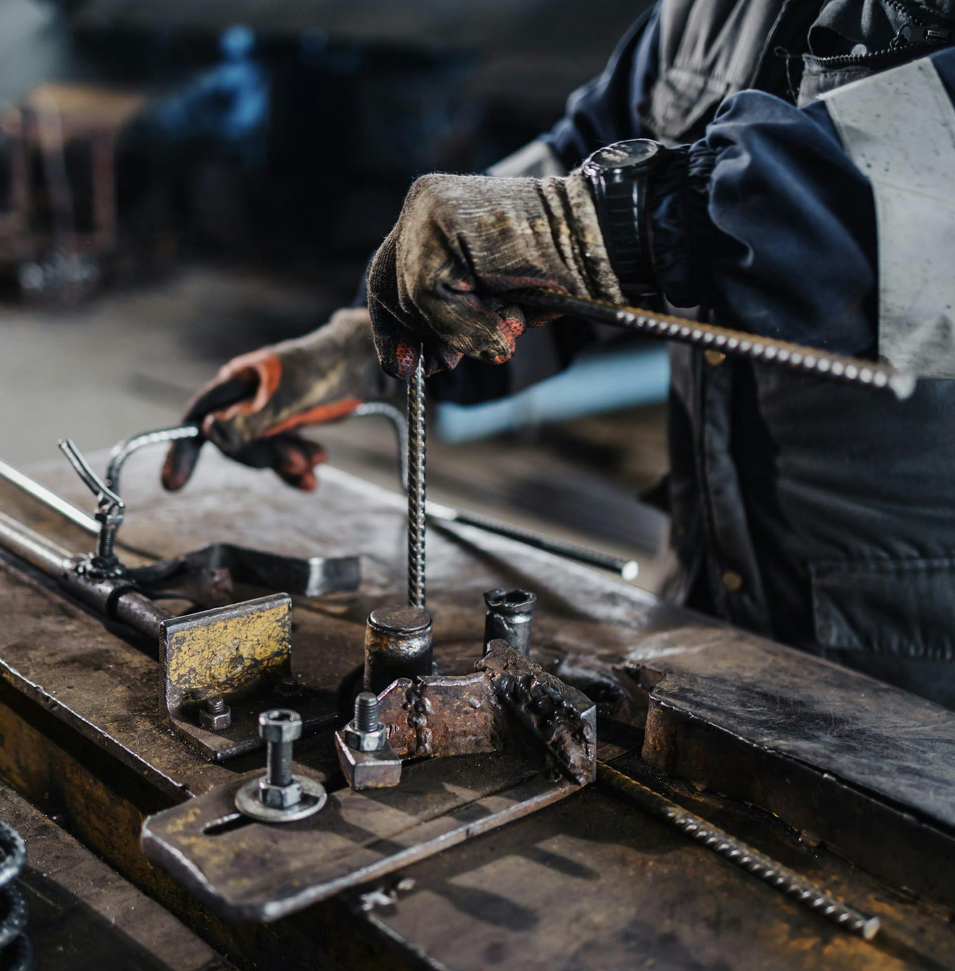 Man working with metal in workshop