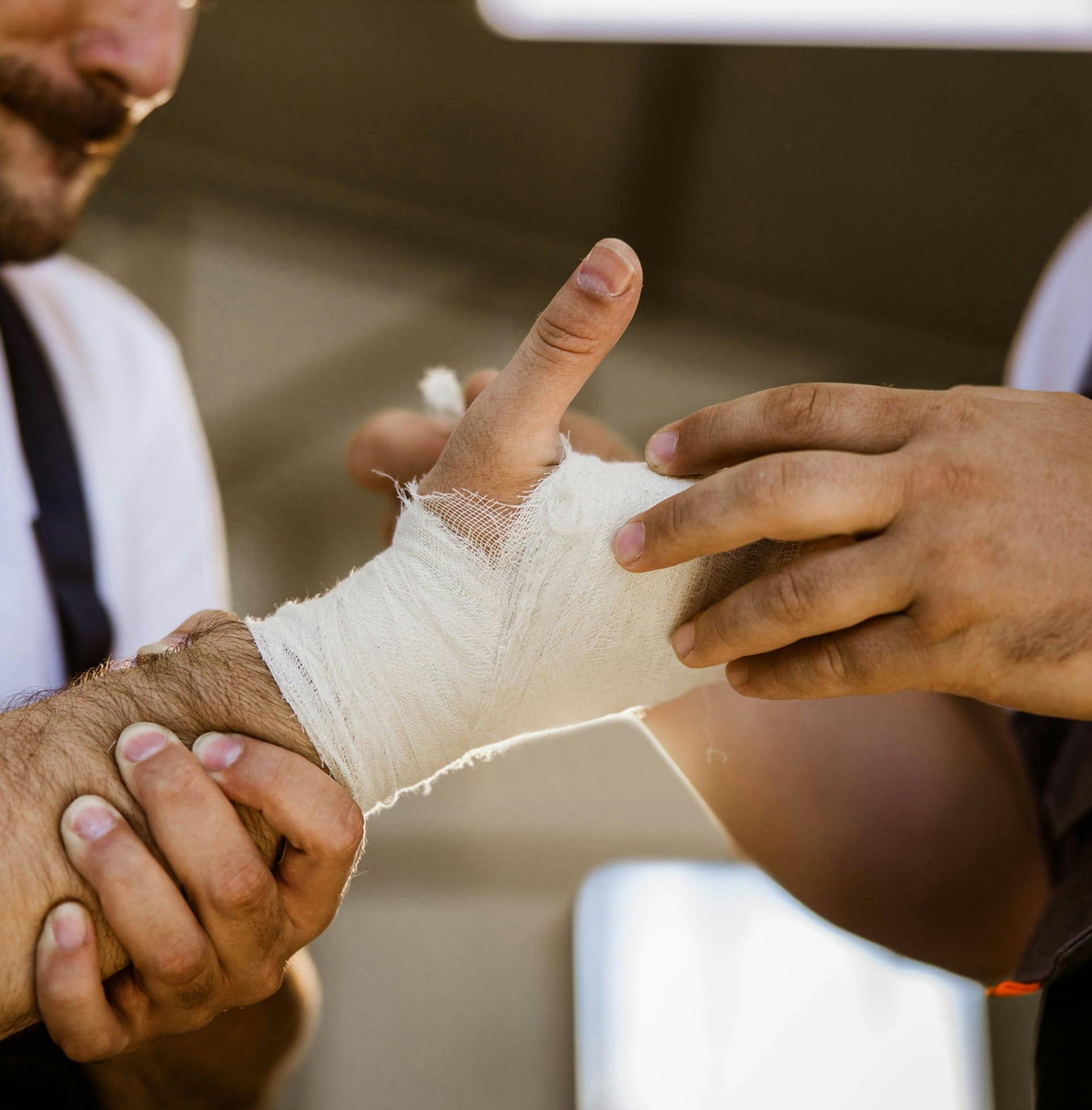 Man with bandaged hand and wrist