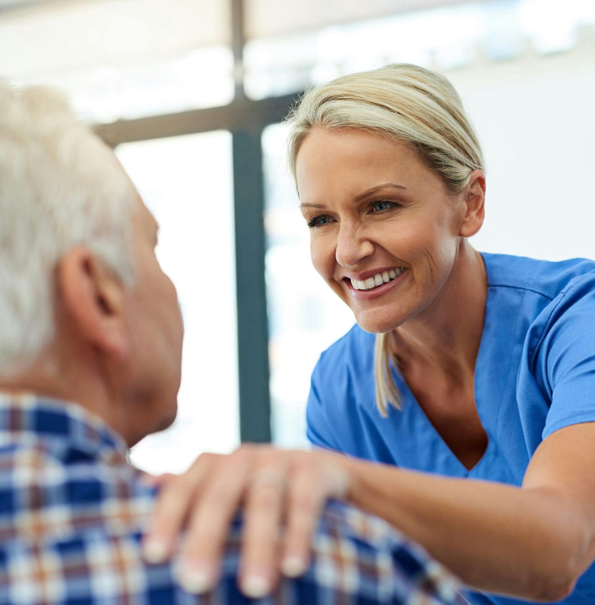 Doctor Smiling and helping patient
