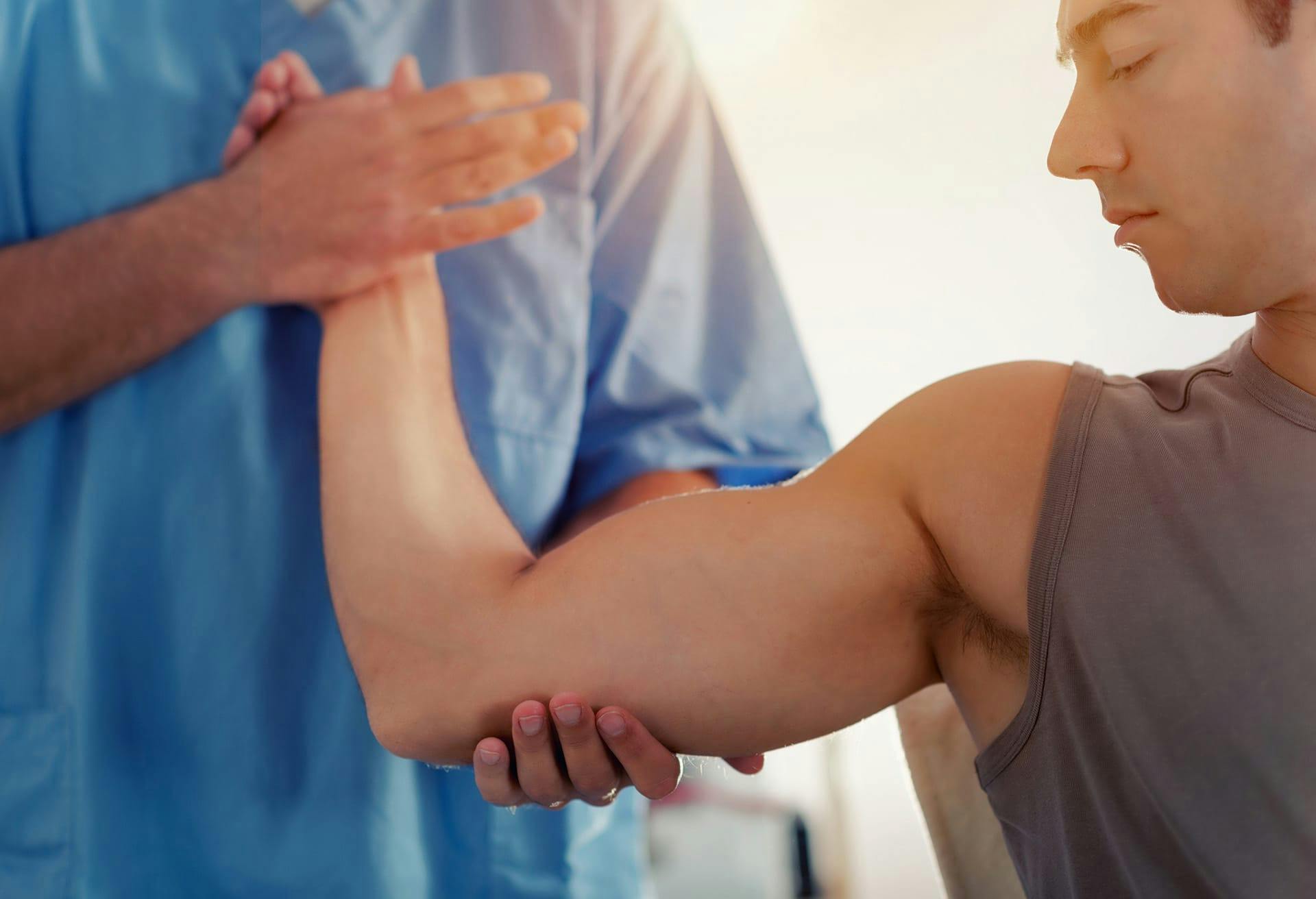 Doctor examining Patient's elbow