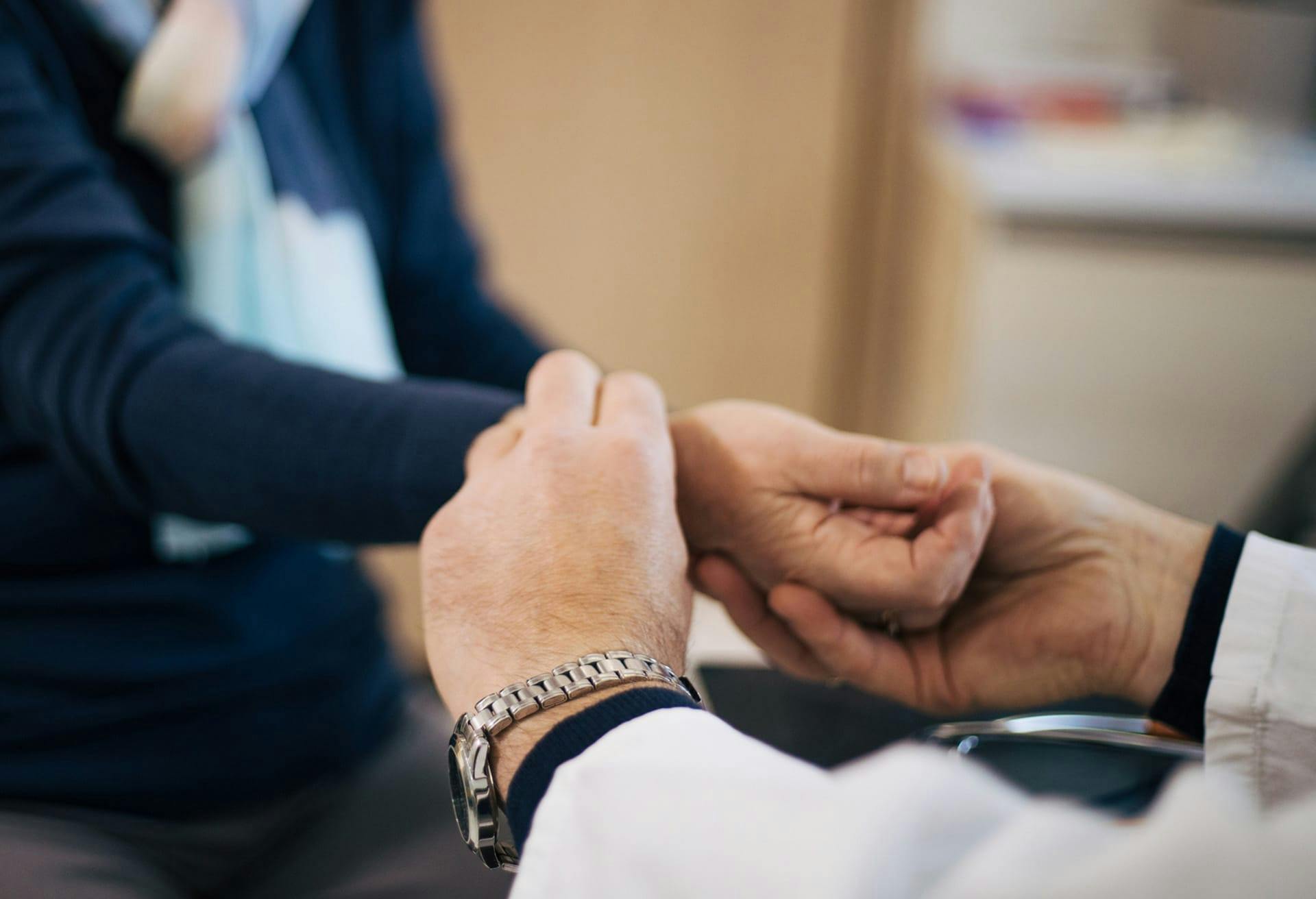 doctor examining patient wrist