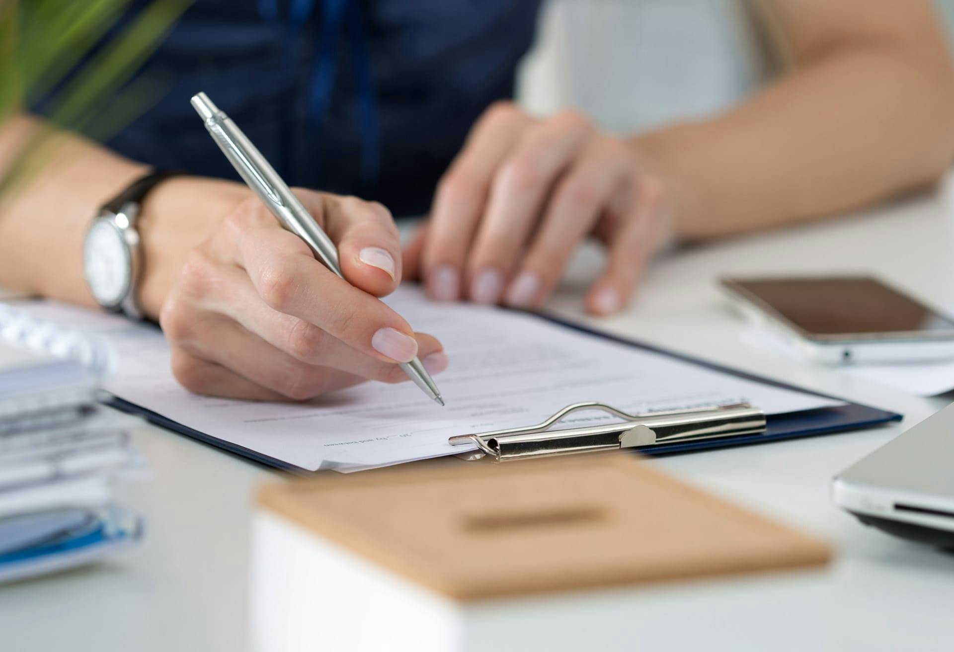 person signing papers