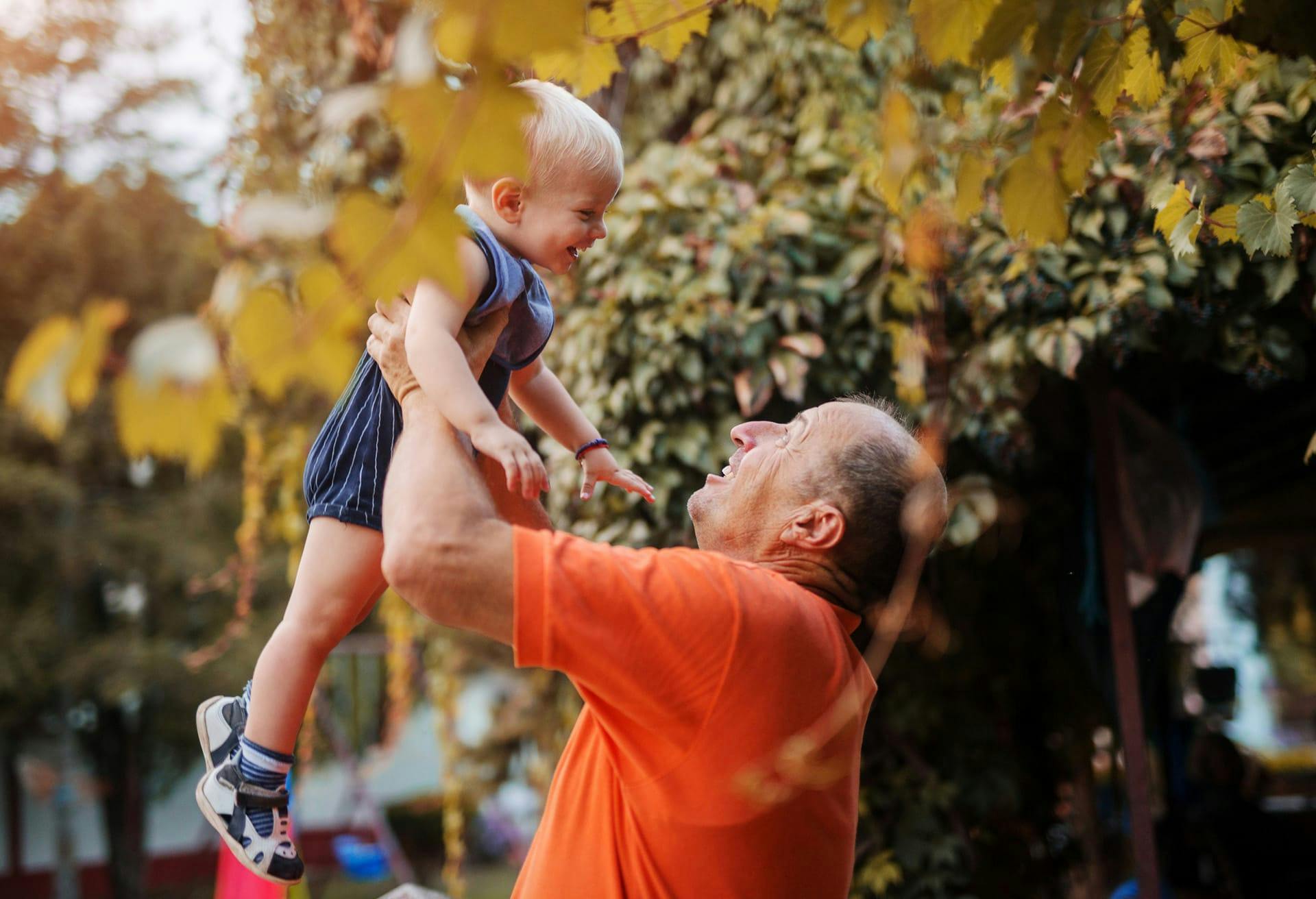 Man holding smiling child