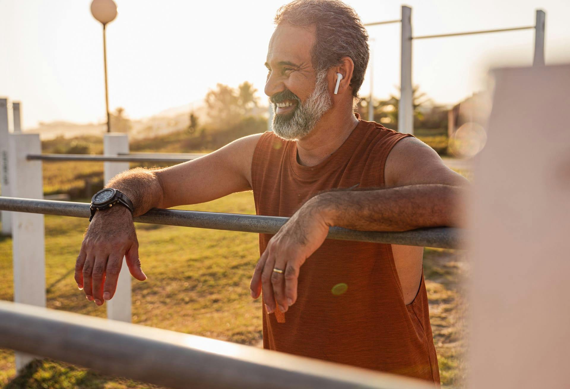 Man smiling and resting arms