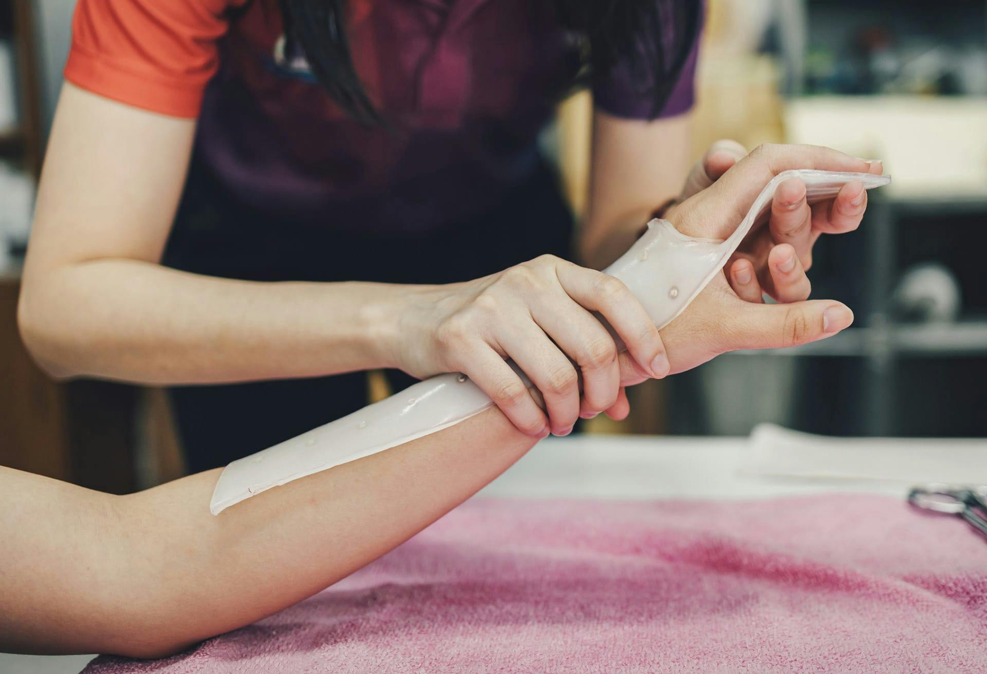 Doctor examining wrist