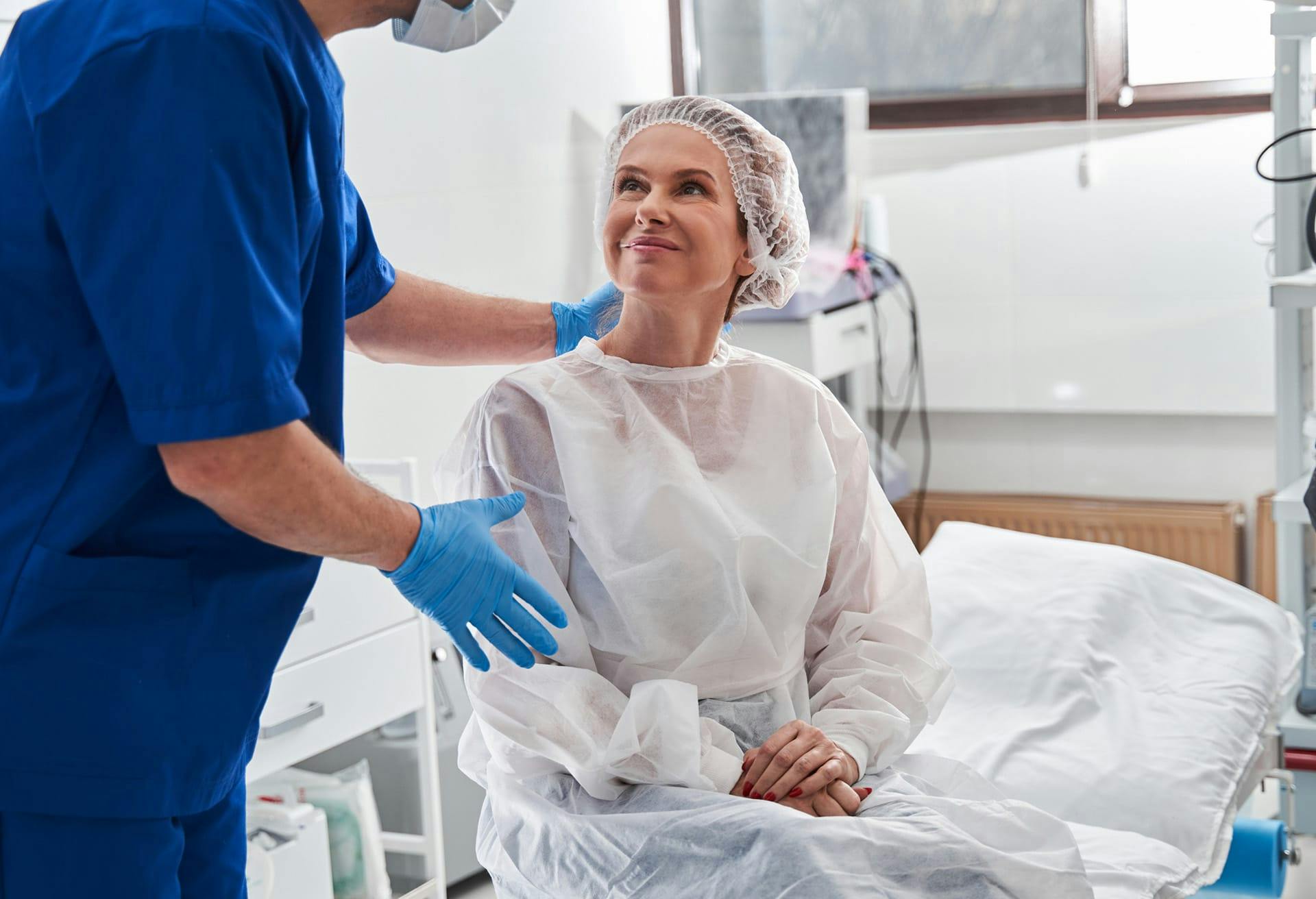 Patient smiling and looking at Doctor