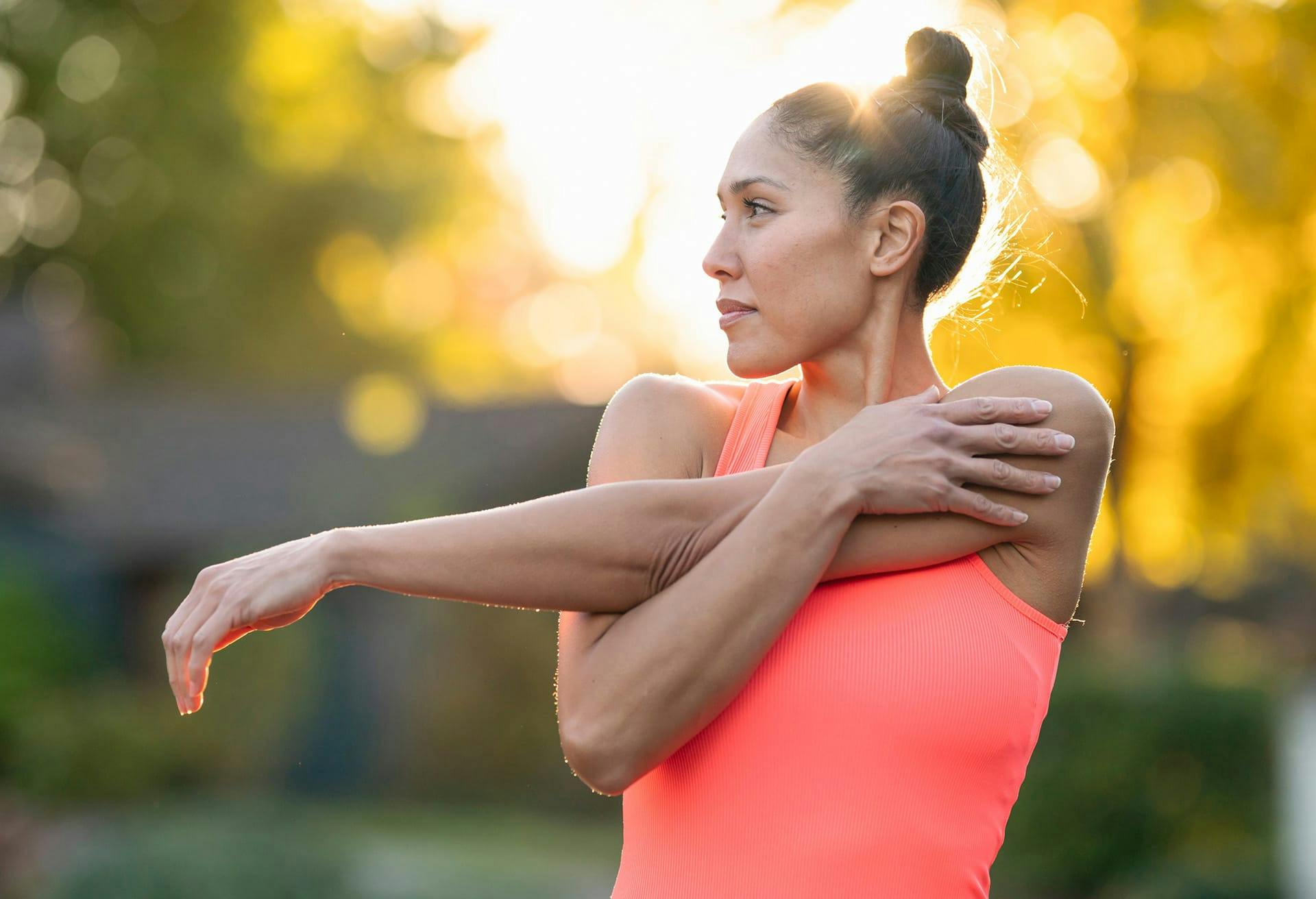 Woman stretching arm