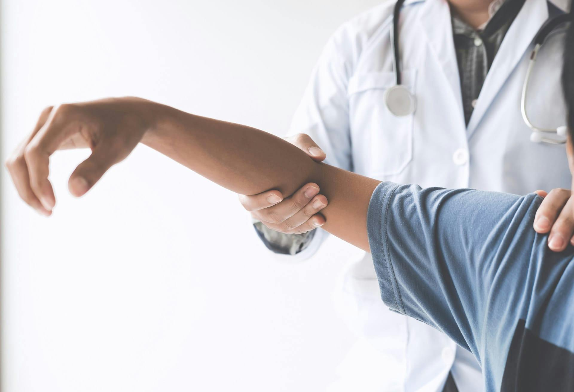 Doctor Examining Patient's arm