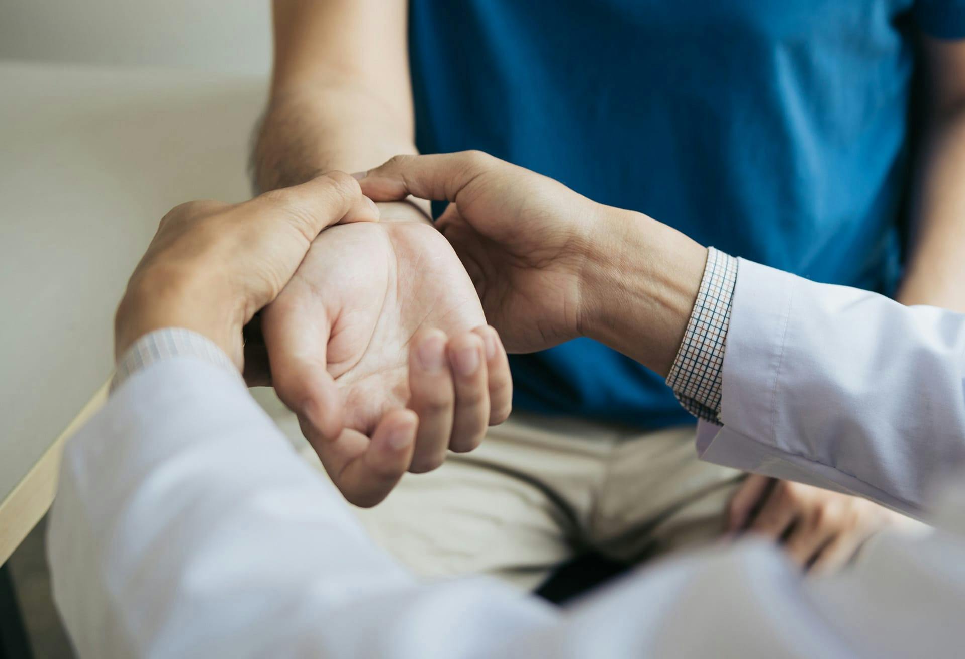 Doctor looking at wrist