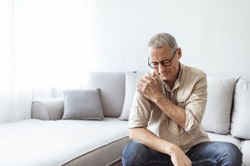 man with shoulder pain