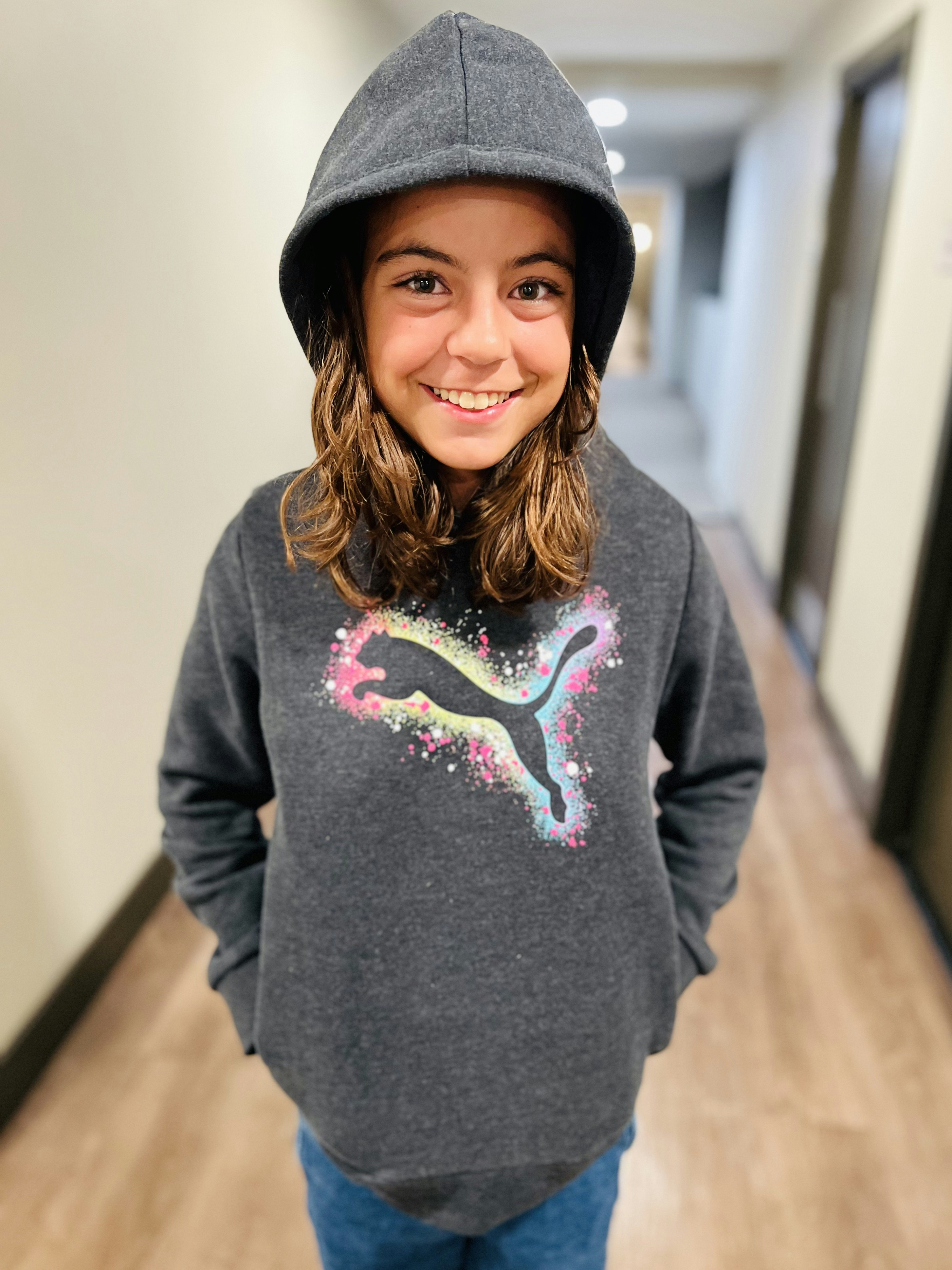 Img: knitwear, sweater, sweatshirt, hoodie, long sleeve, cap, hat, face, smile, hood