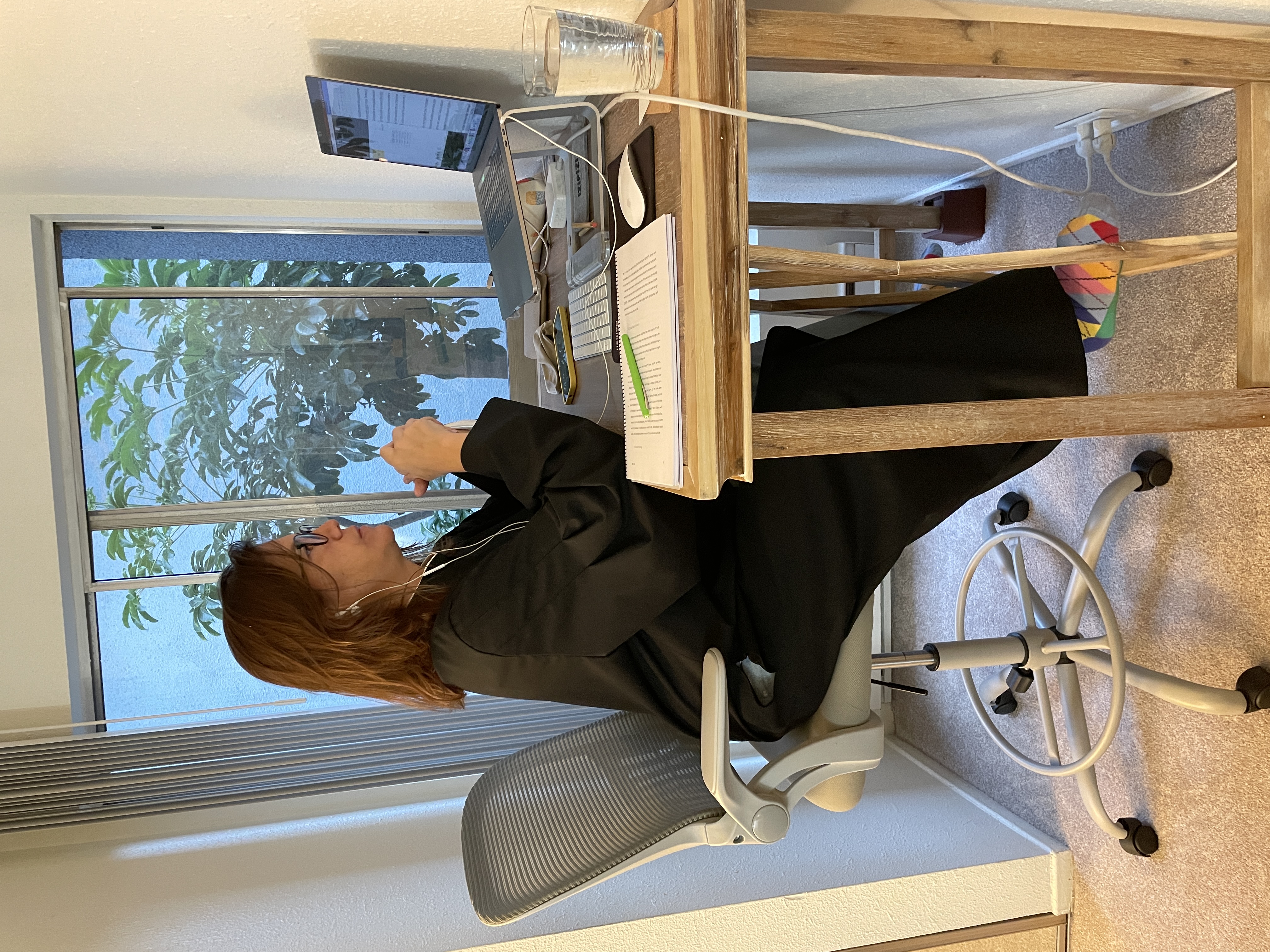 Img: furniture, table, desk, person, sitting, adult, female, woman, laptop, pen