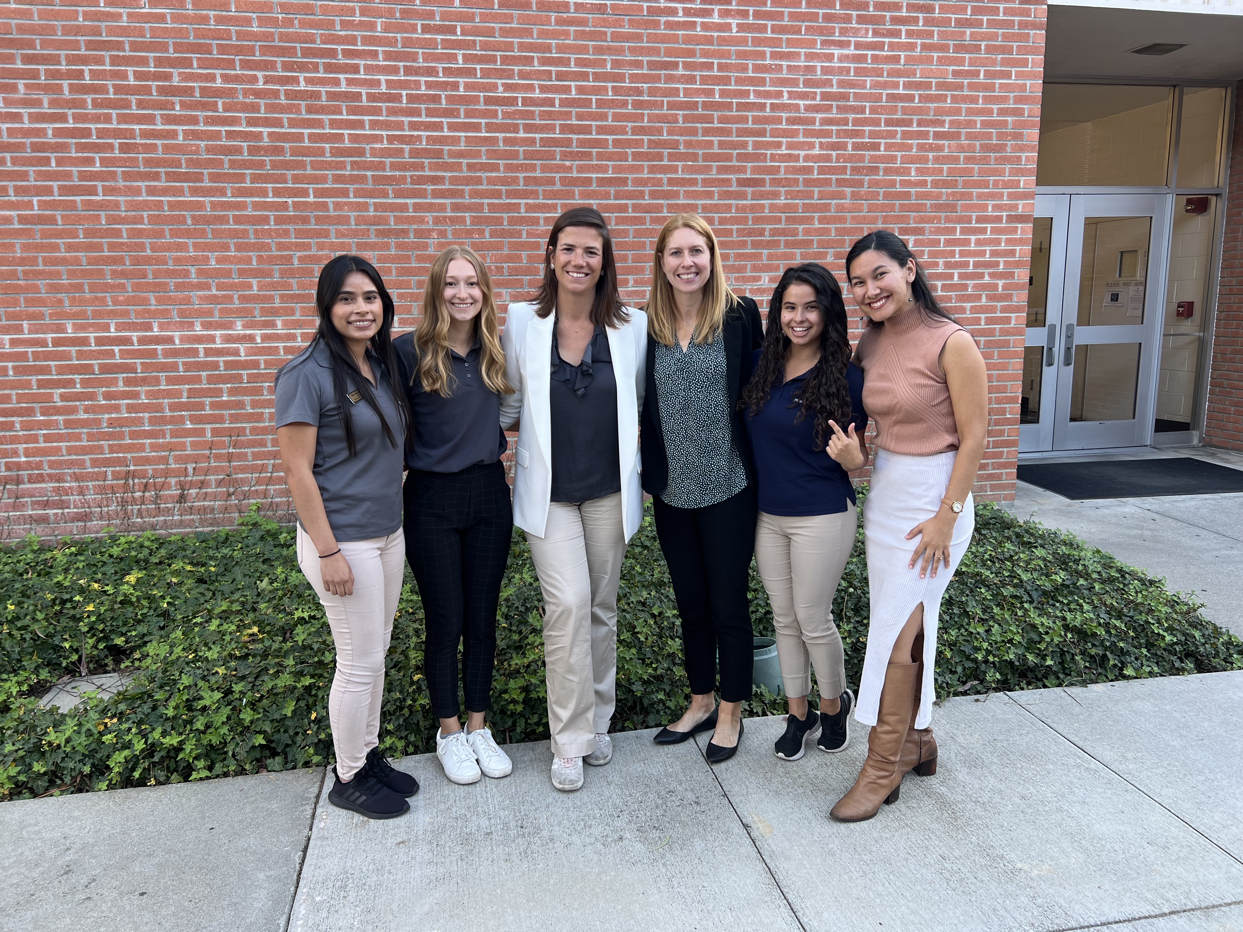 Img: groupshot, person, pants, blazer, coat, people, adult, female, woman, shoe