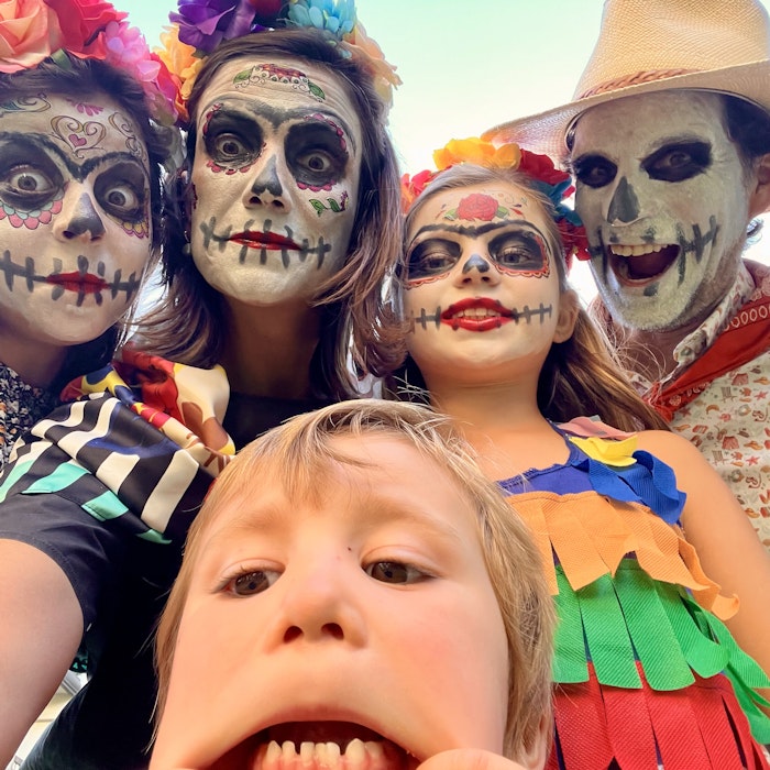 Img: adult, female, person, woman, clothing, hat, baby, face, head, festival