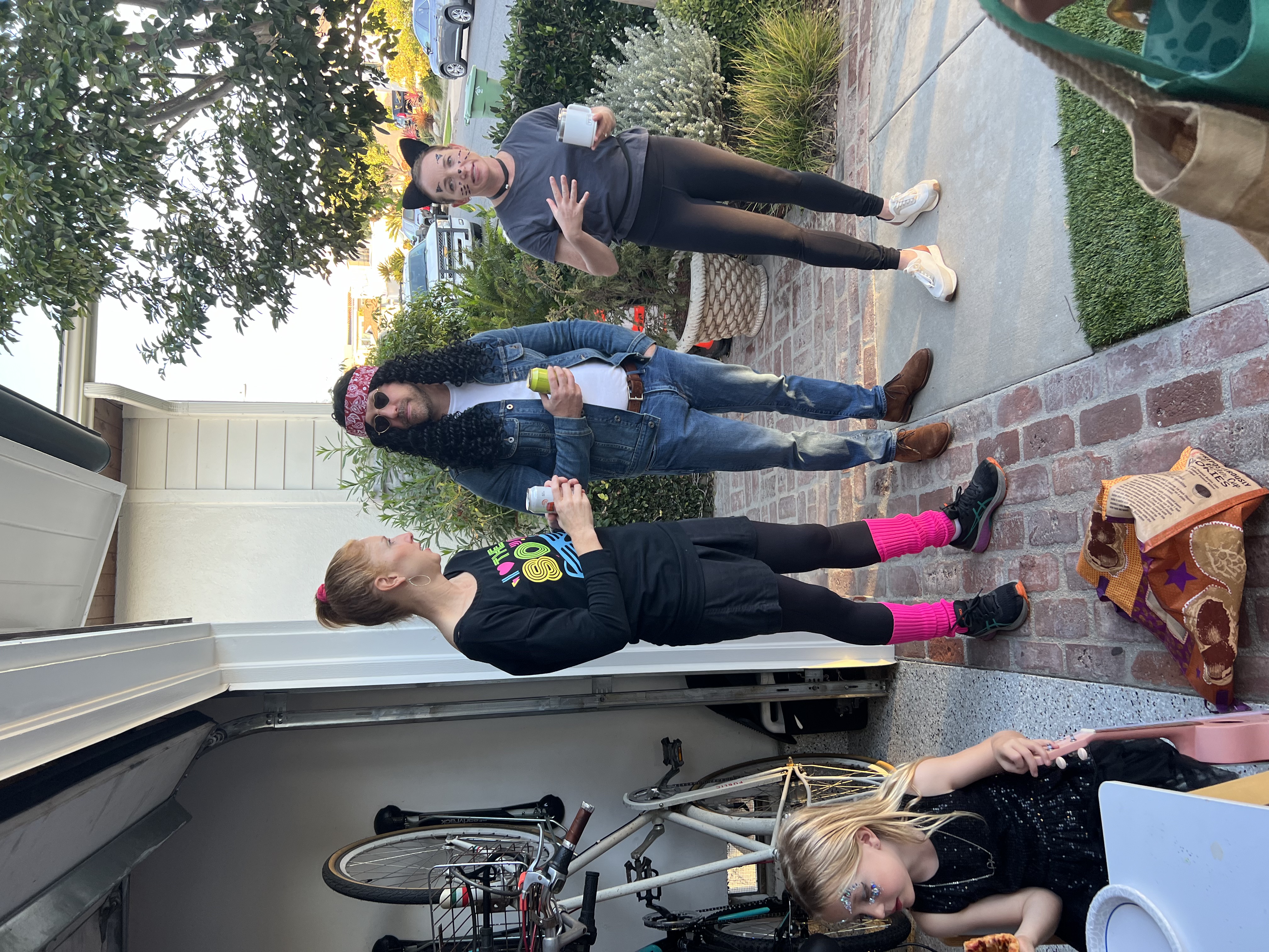 Img: pants, jeans, child, female, girl, person, handbag, necklace, glasses, car