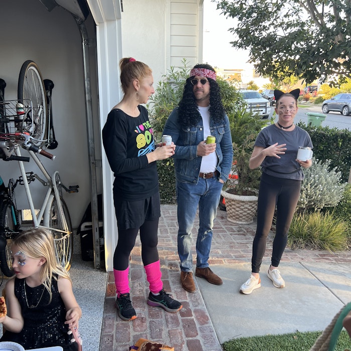 Img: pants, jeans, child, female, girl, person, handbag, necklace, glasses, car