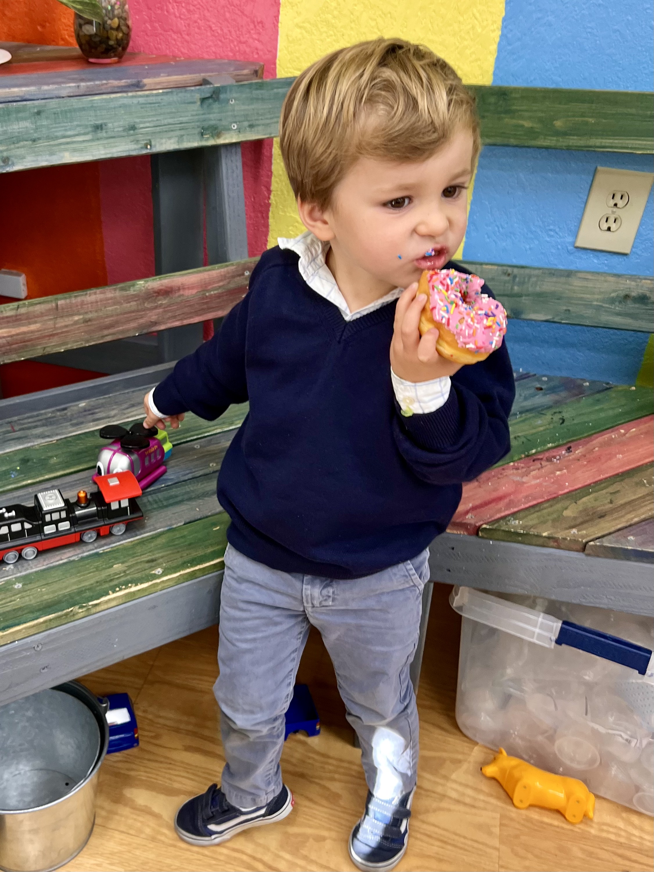 Img: boy, child, male, person, eating, food, footwear, shoe, head, face