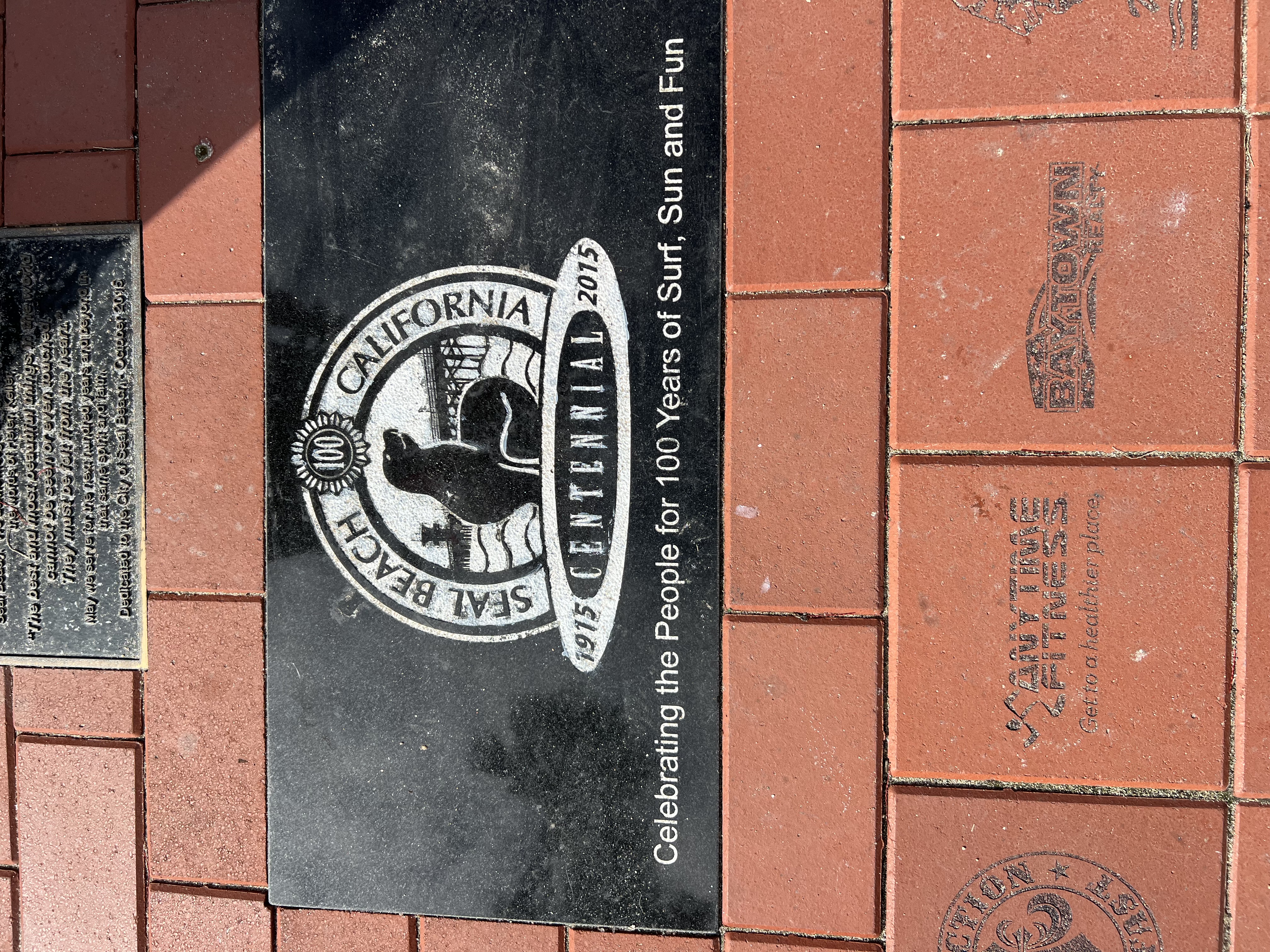 Img: brick, path, walkway, plaque, logo, floor