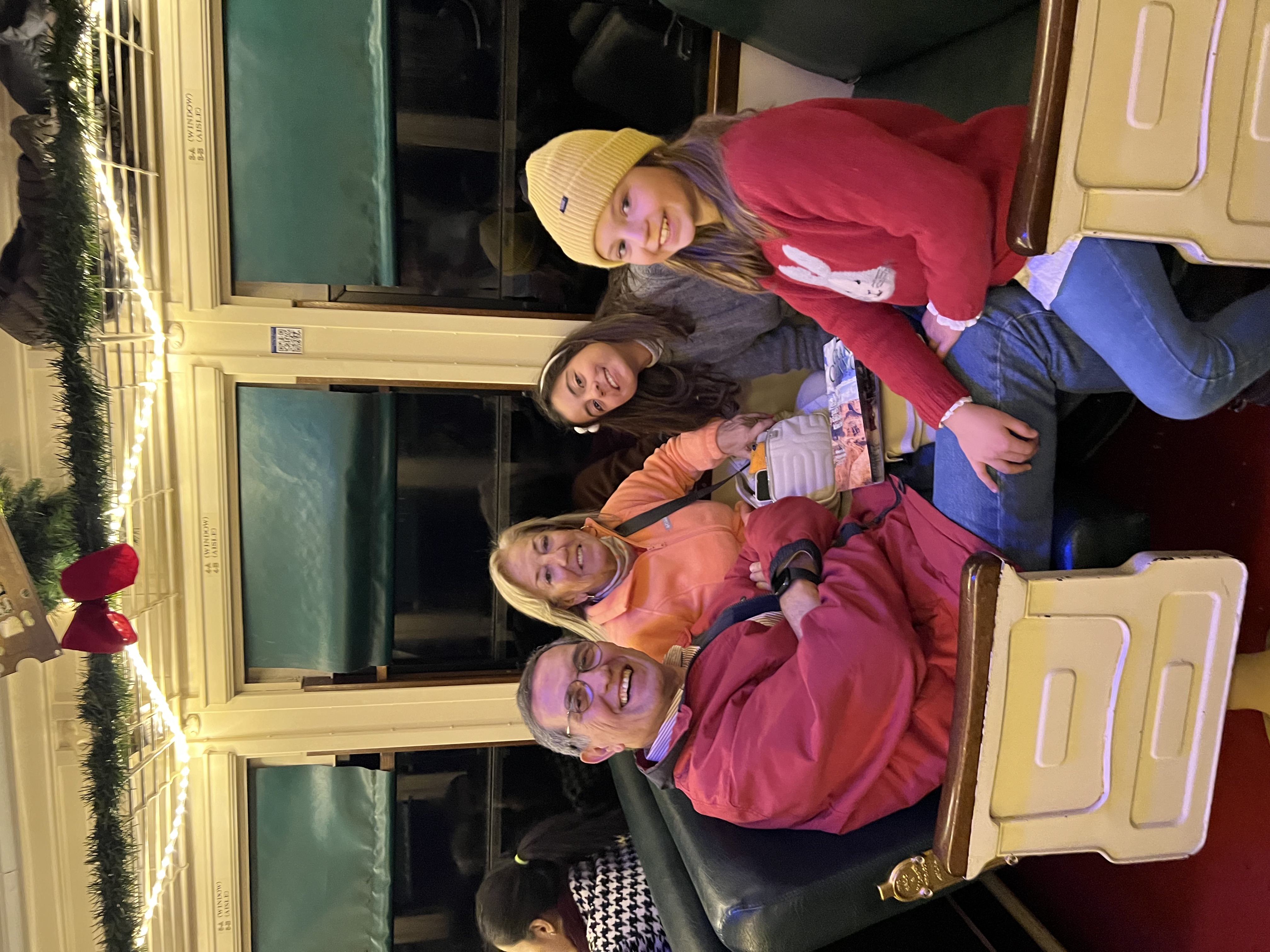 Img: couch, hat, restaurant, cap, person, wristwatch, glasses, adult, female, woman