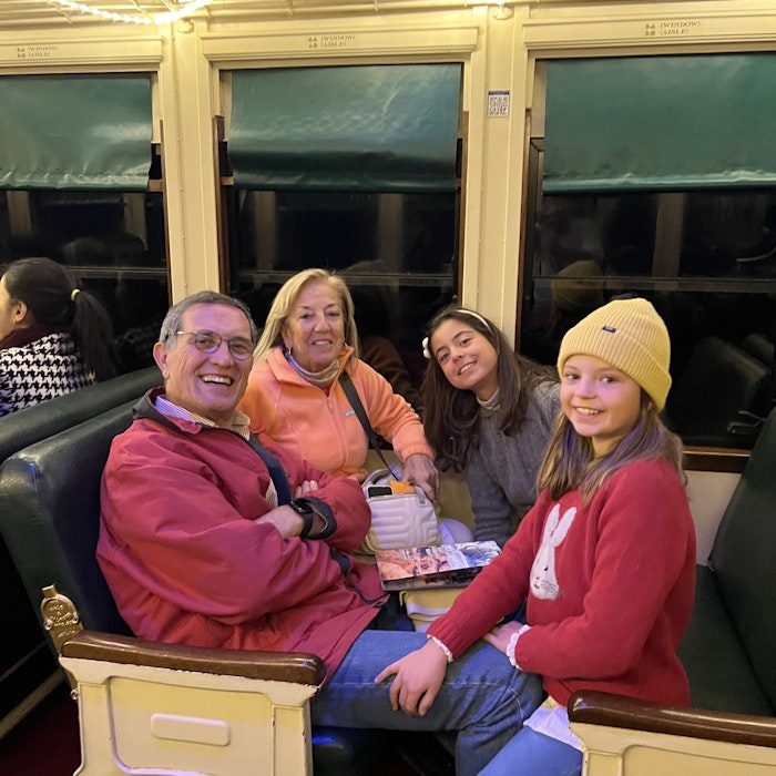 Img: couch, hat, restaurant, cap, person, wristwatch, glasses, adult, female, woman