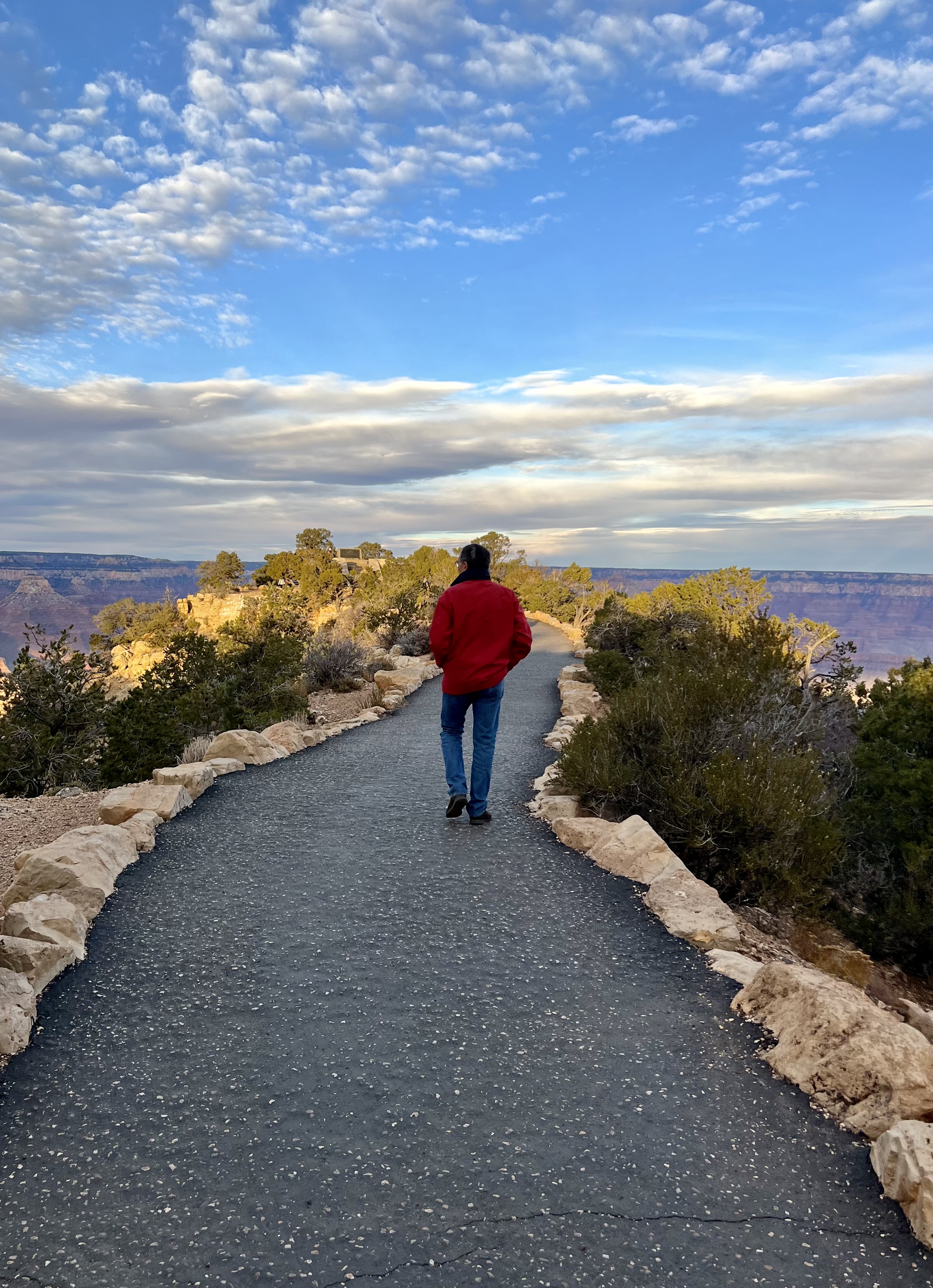 Img: pants, walking, path, sky, rock, scenery, jeans, shoe, portrait, road