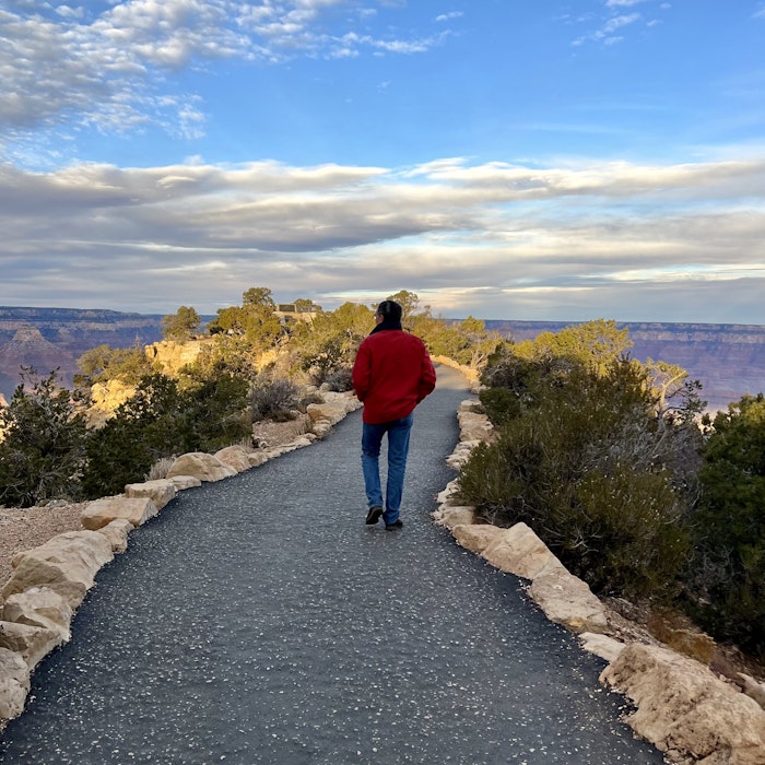 Img: pants, walking, path, sky, rock, scenery, jeans, shoe, portrait, road
