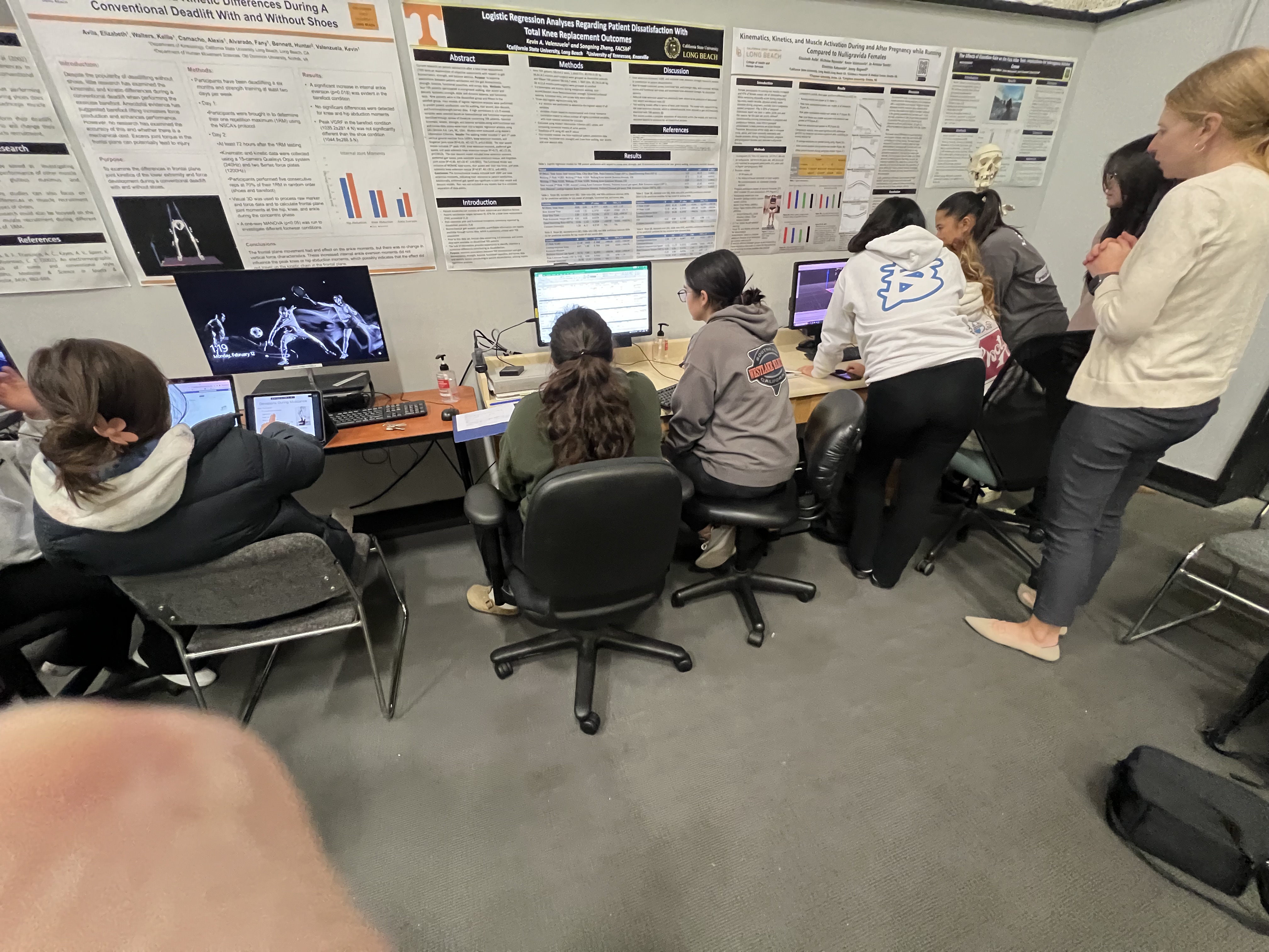 Img: adult, female, person, woman, chair, shoe, computer keyboard, monitor, tablet computer, indoors