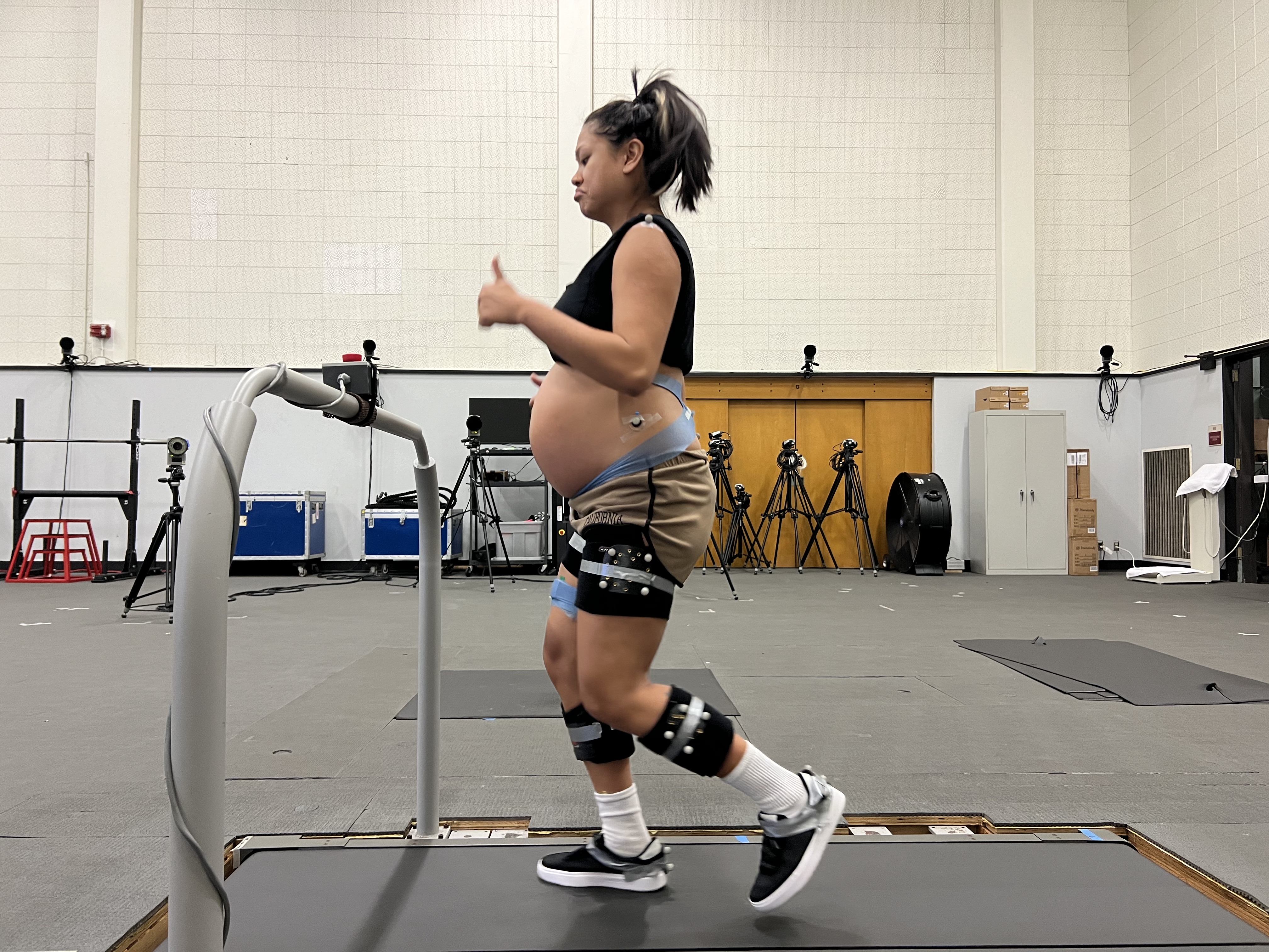 Img: clothing, footwear, shoe, person, electronics, speaker, computer, laptop, pc, working out