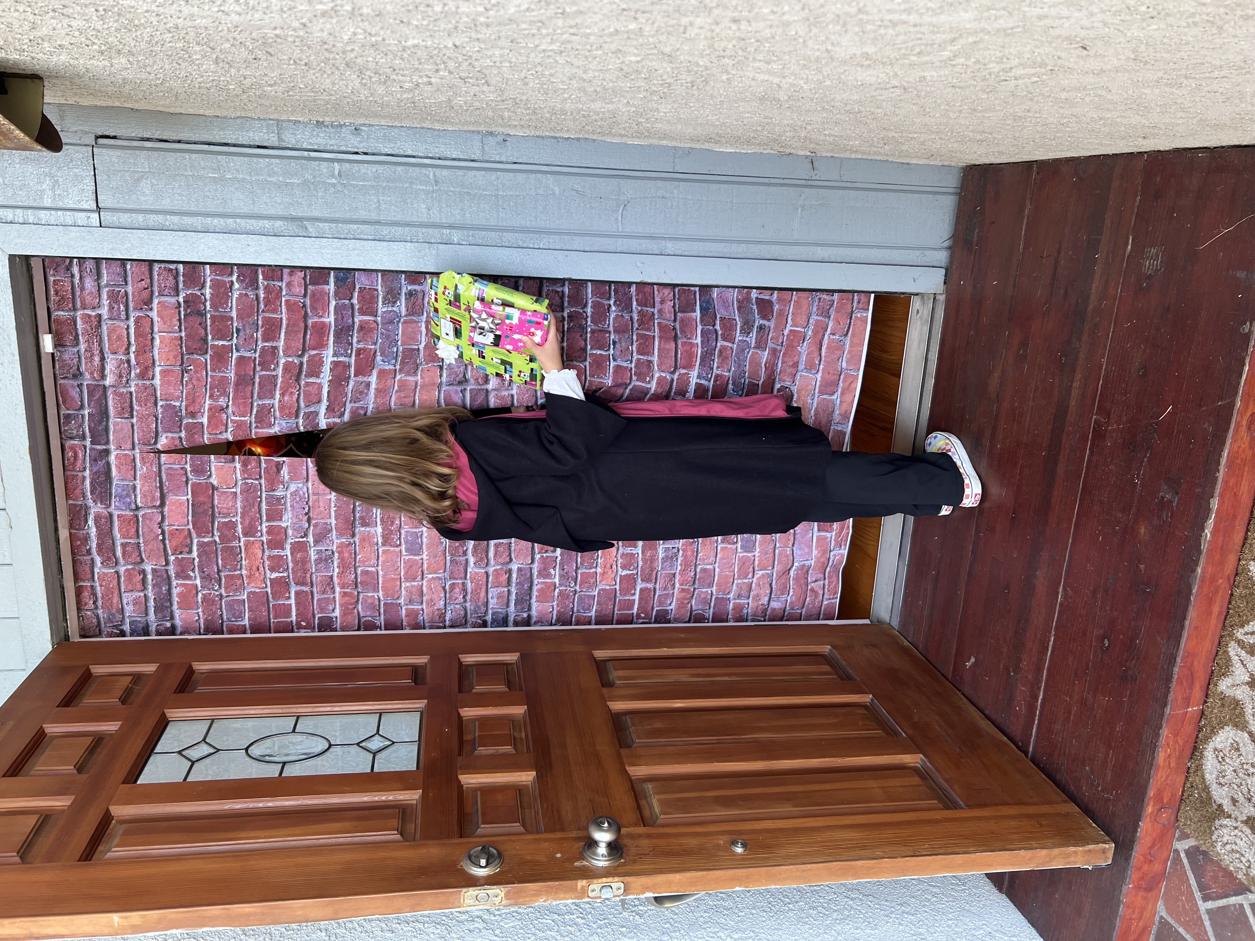 Img: wood, floor, flooring, hardwood, door, coat, person, portrait, interior design, flower bouquet