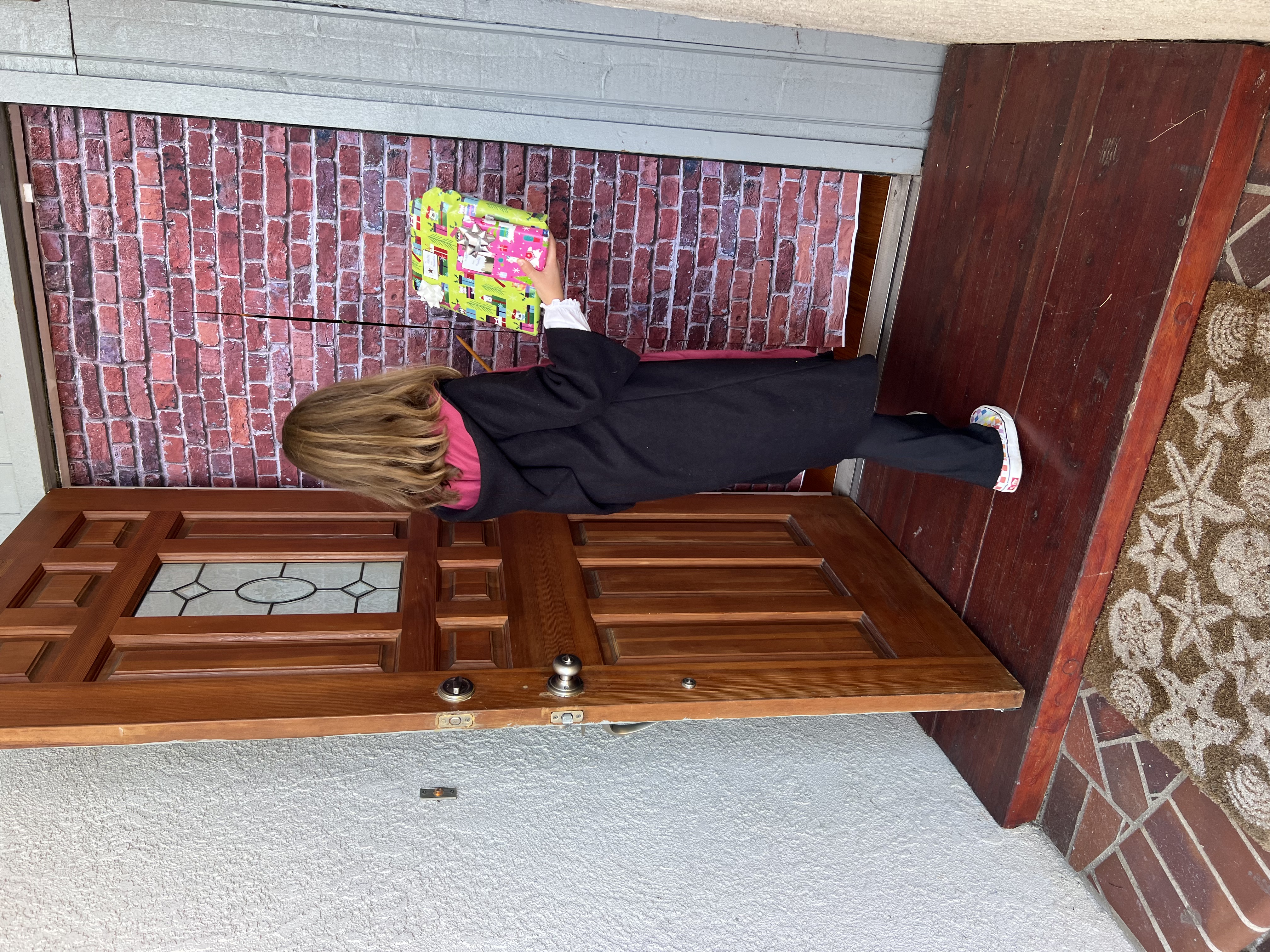 Img: wood, floor, flooring, hardwood, door, coat, interior design, pants, person, portrait