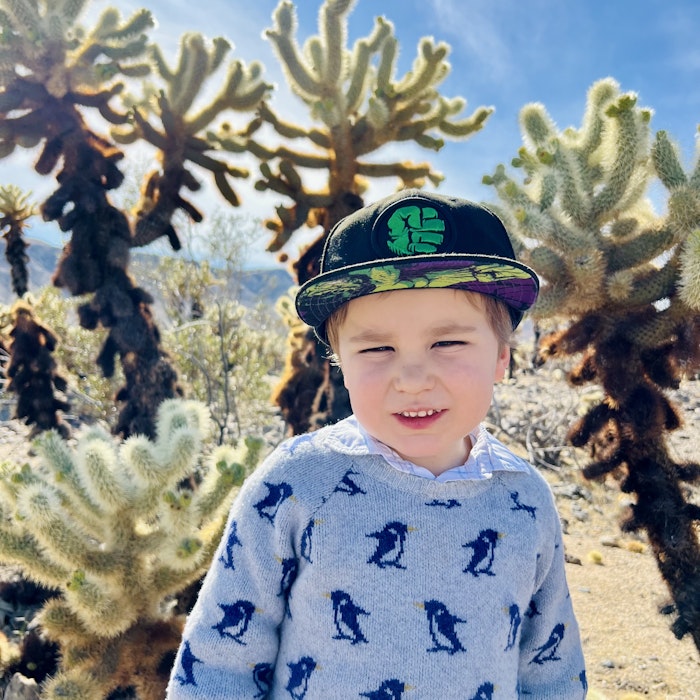 Img: face, head, person, photography, portrait, cap, hat, smile, cactus, sweater