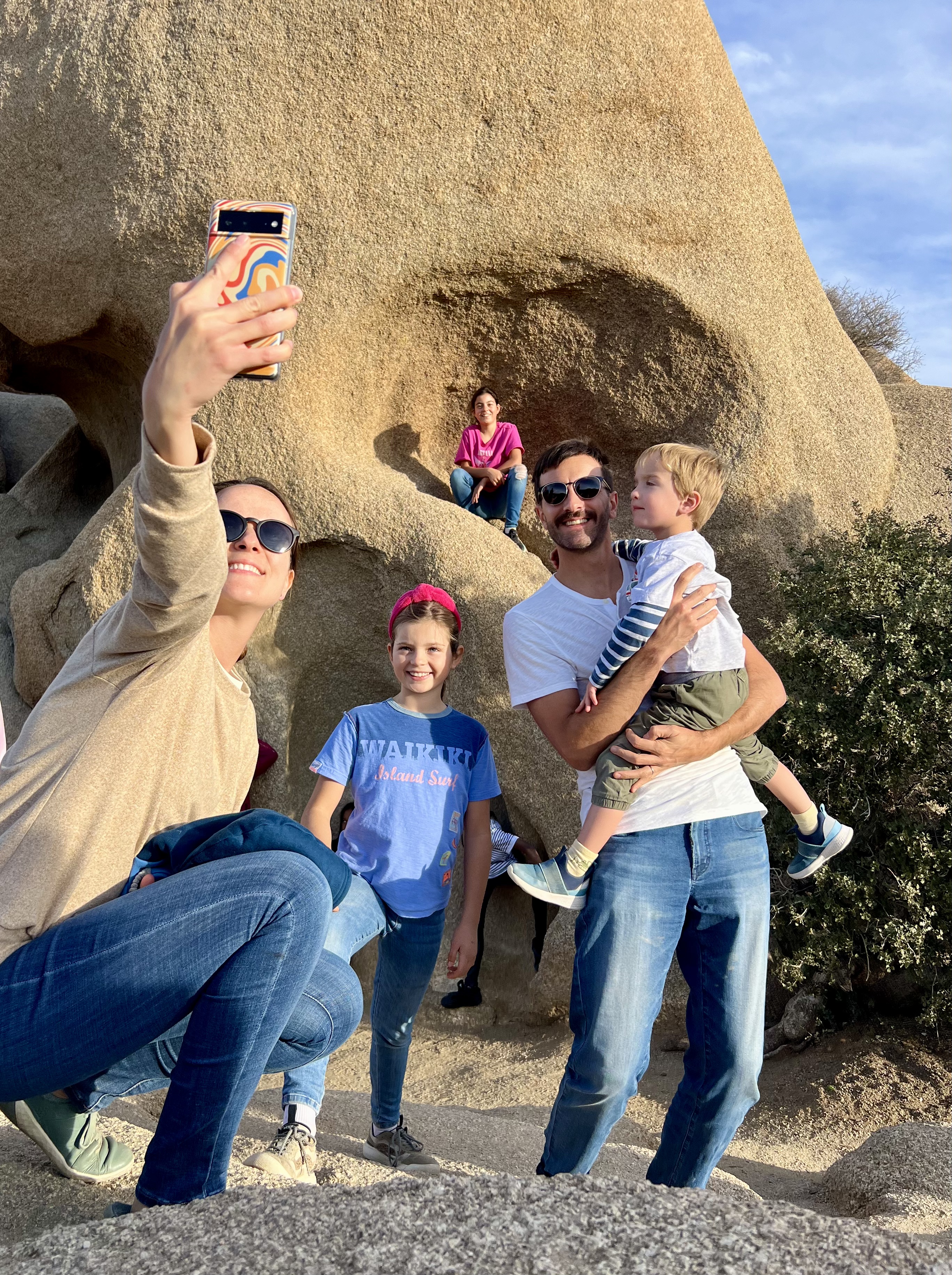 Img: pants, head, person, photography, portrait, jeans, rock, sunglasses, shoe, people