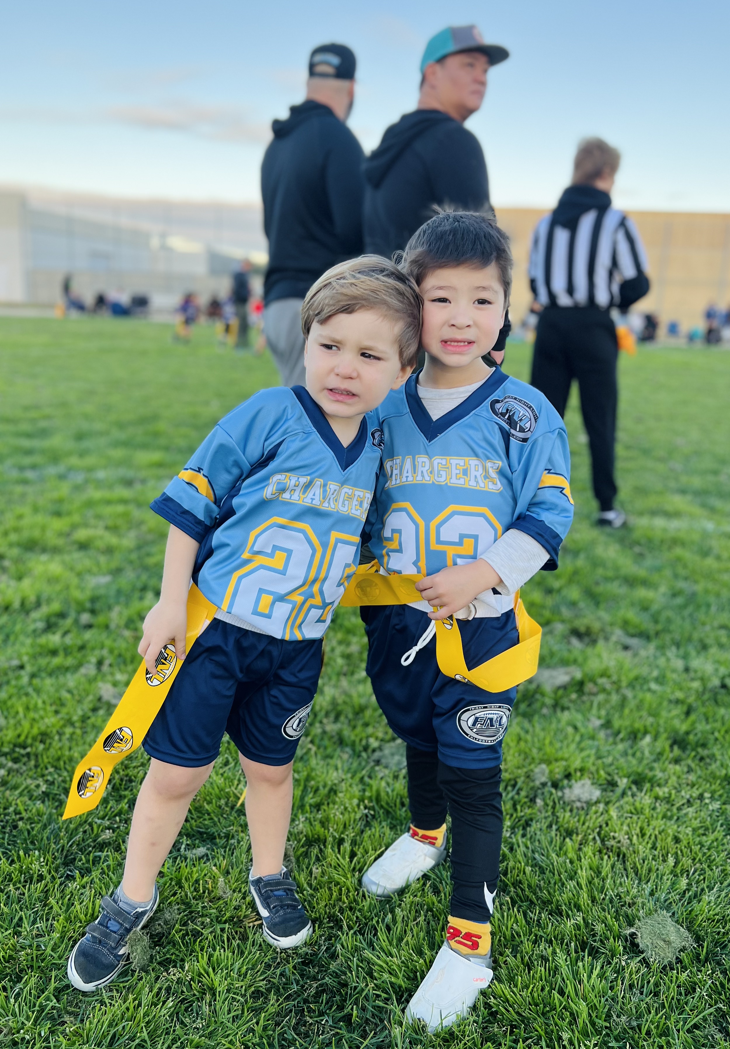 Img: people, person, shorts, grass, boy, child, male, adult, man, hat