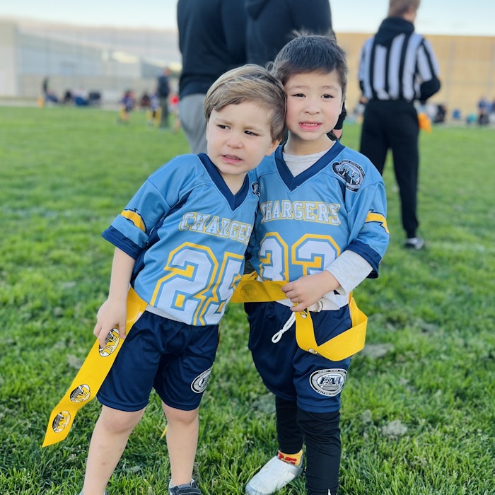 Img: people, person, shorts, grass, boy, child, male, adult, man, hat