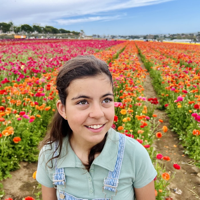 Img: face, head, person, photography, portrait, flower, smile, field, petal, grassland