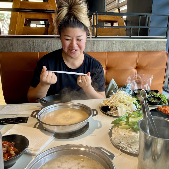 Img: food, meal, lunch, dish, dining table, restaurant, stew, person, eating, disposable cup